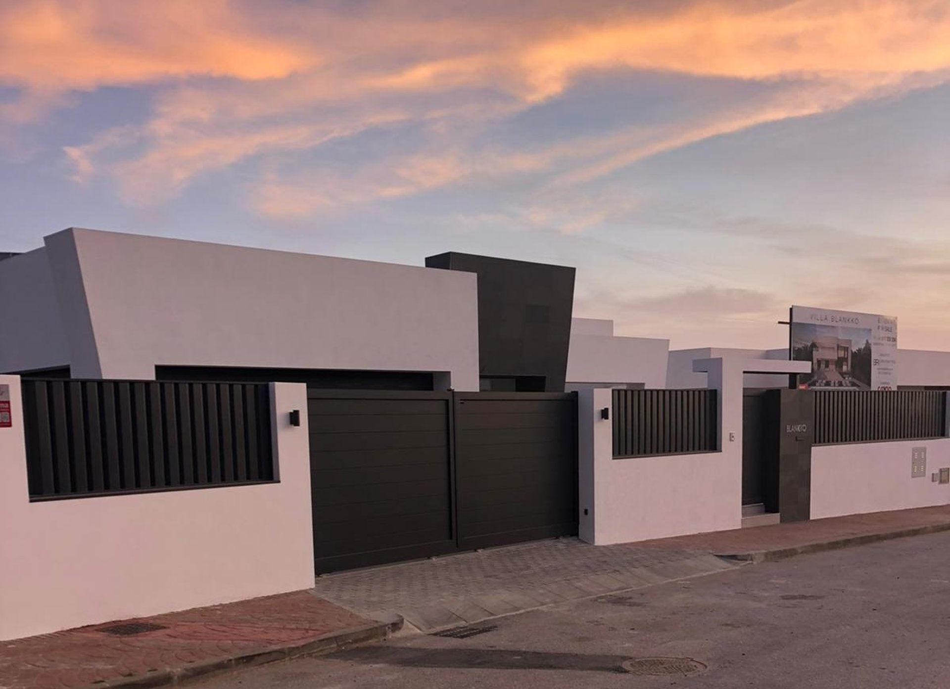 an empty parking garage with yellow barriers
