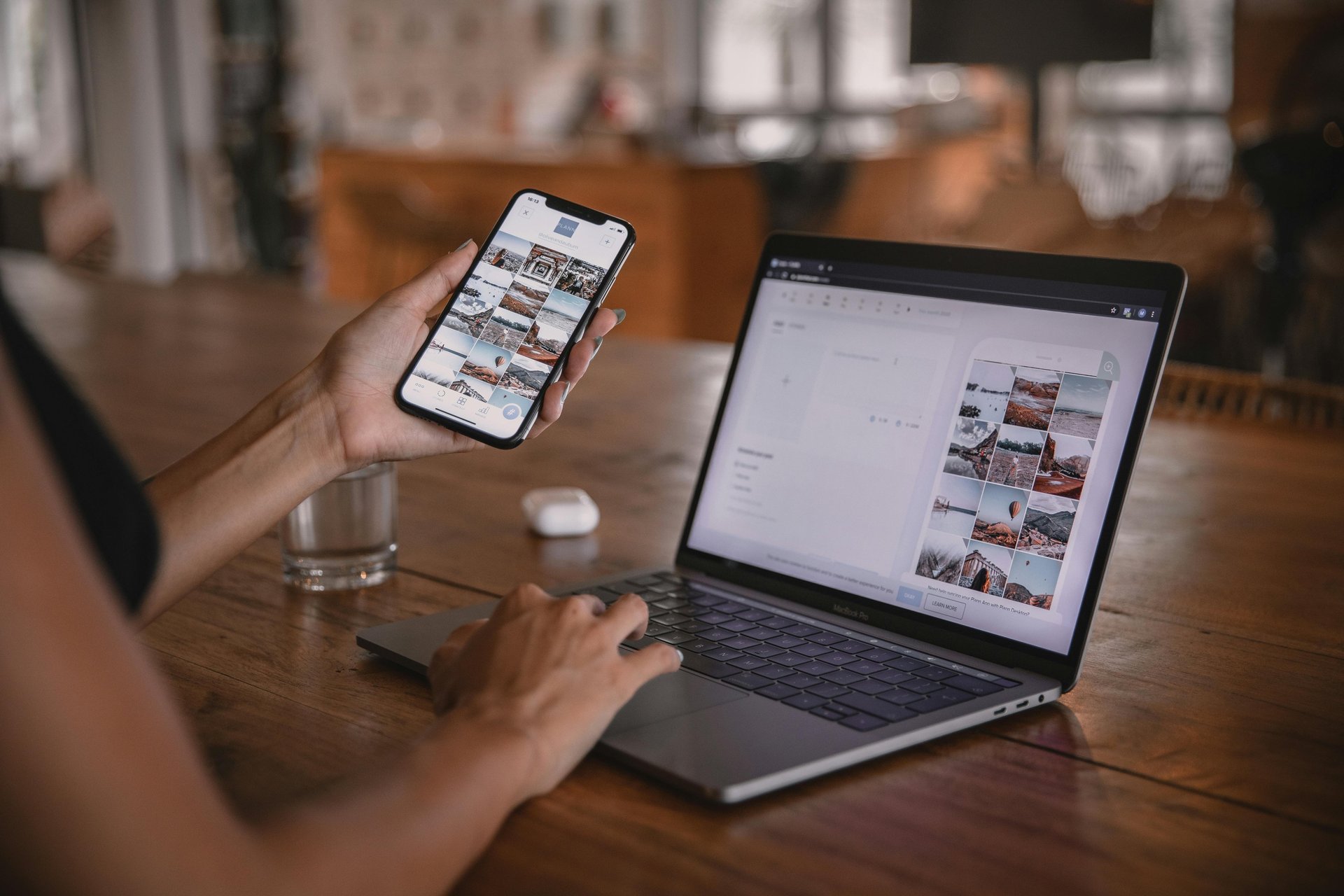 woman in gray shirt sitting on bench in front of MacBook