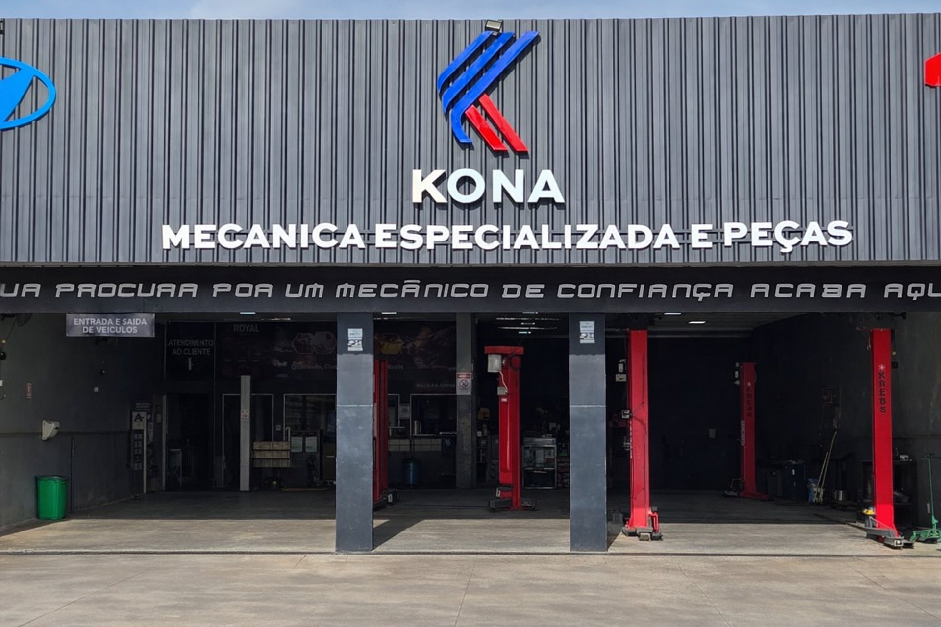 an abstract photo of a curved building with a blue sky in the background