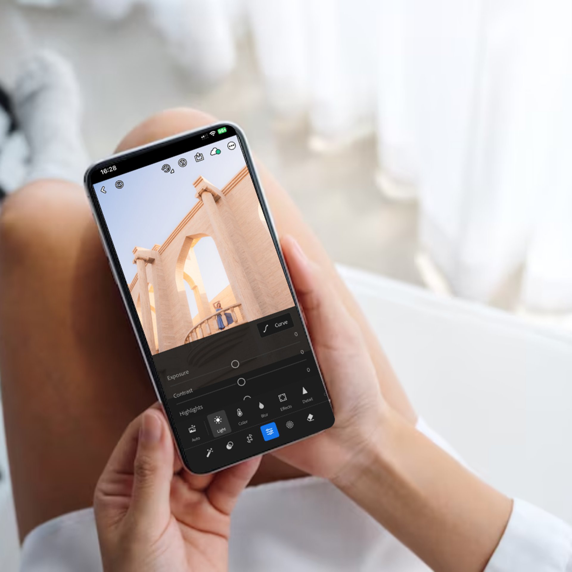 an abstract photo of a curved building with a blue sky in the background