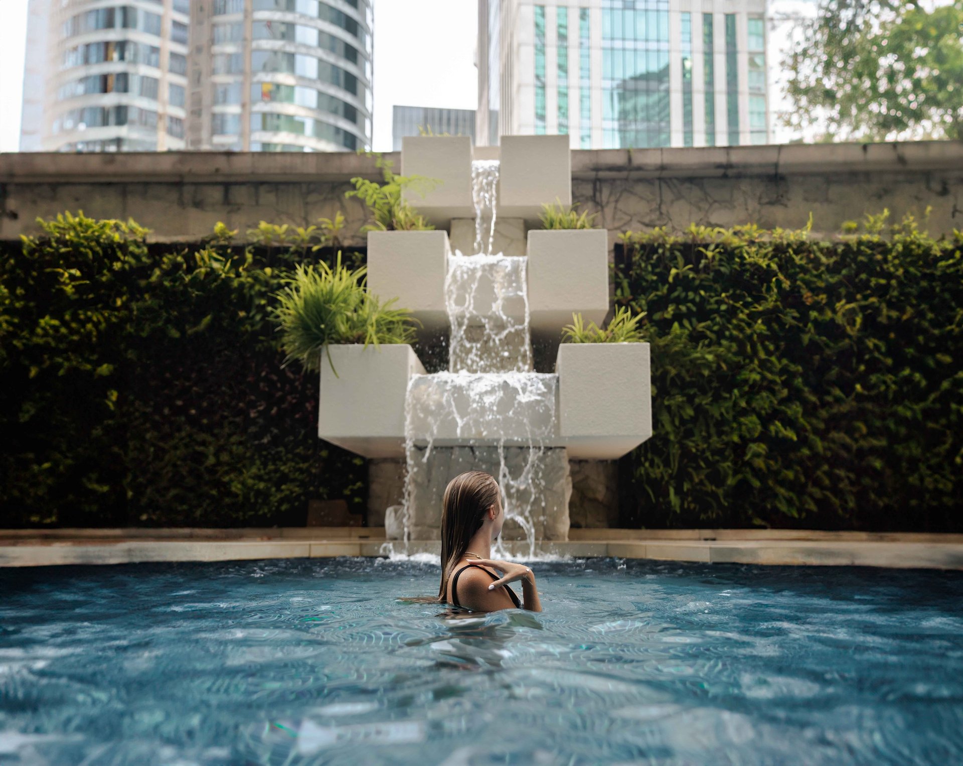 an abstract photo of a curved building with a blue sky in the background