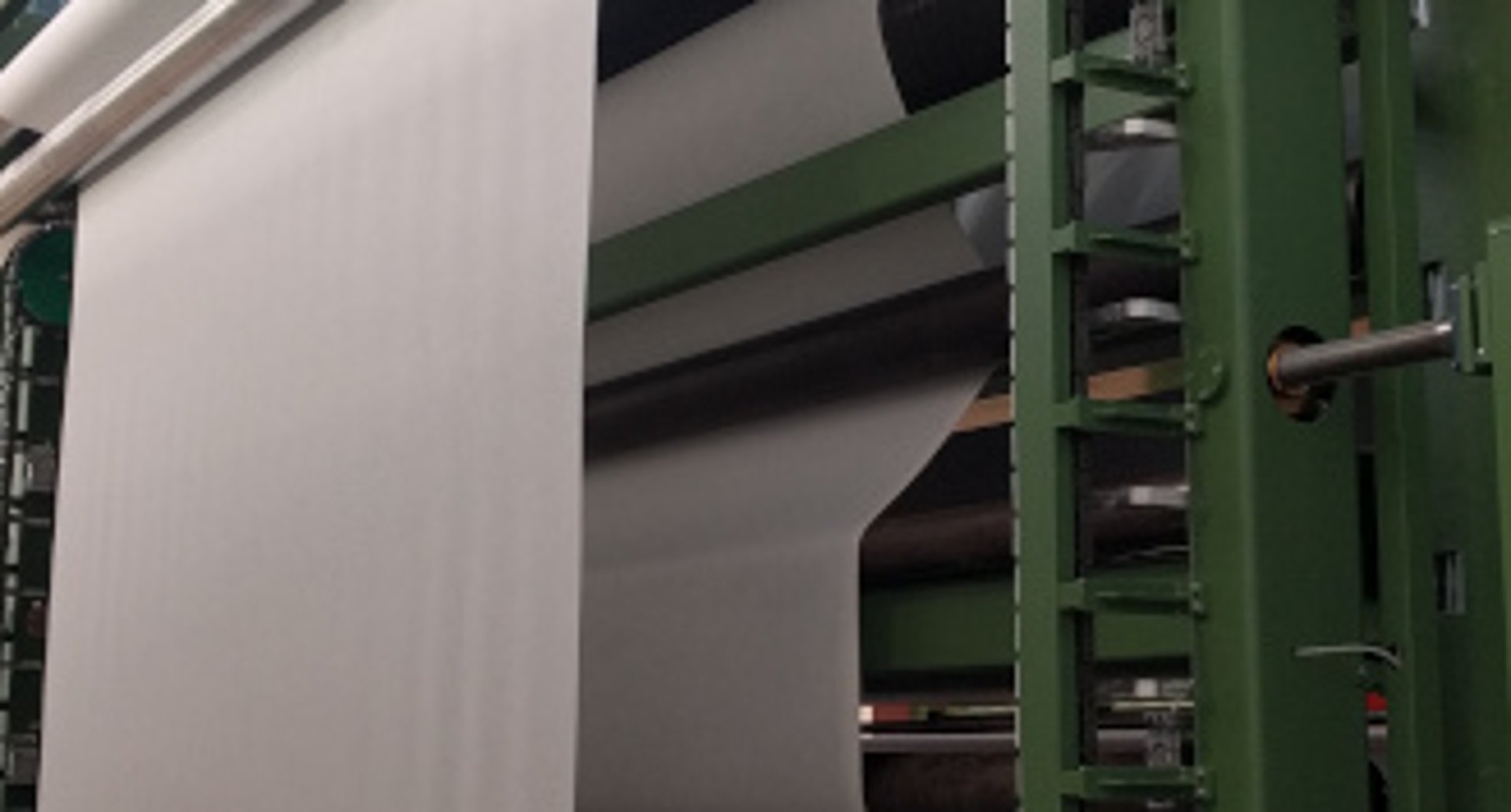 an abstract photo of a curved building with a blue sky in the background