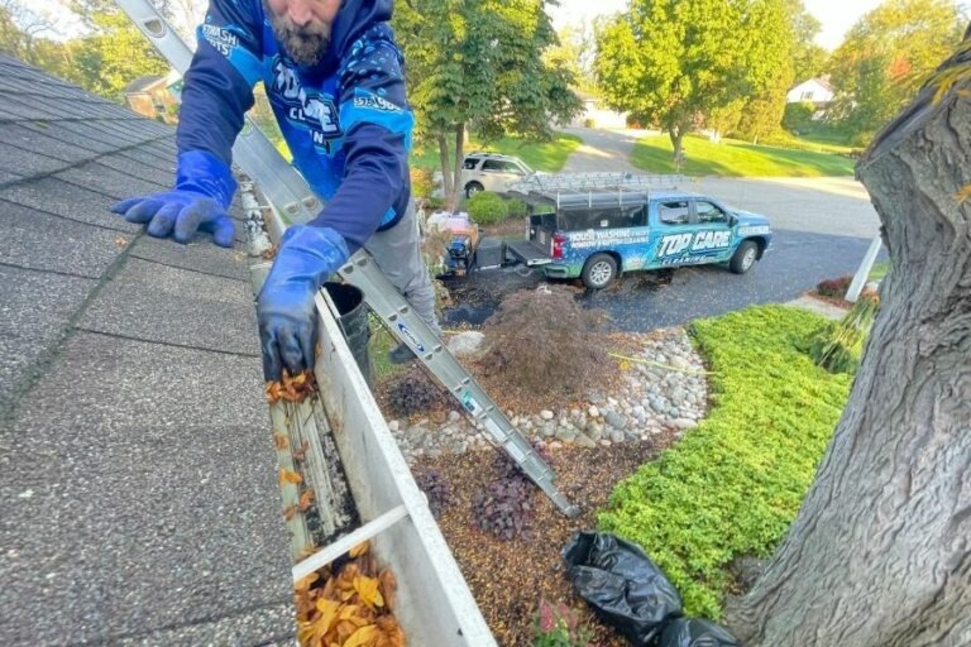 Badger Pro Wash Professionally Cleaning Gutters on a Routine Maintenance Job 