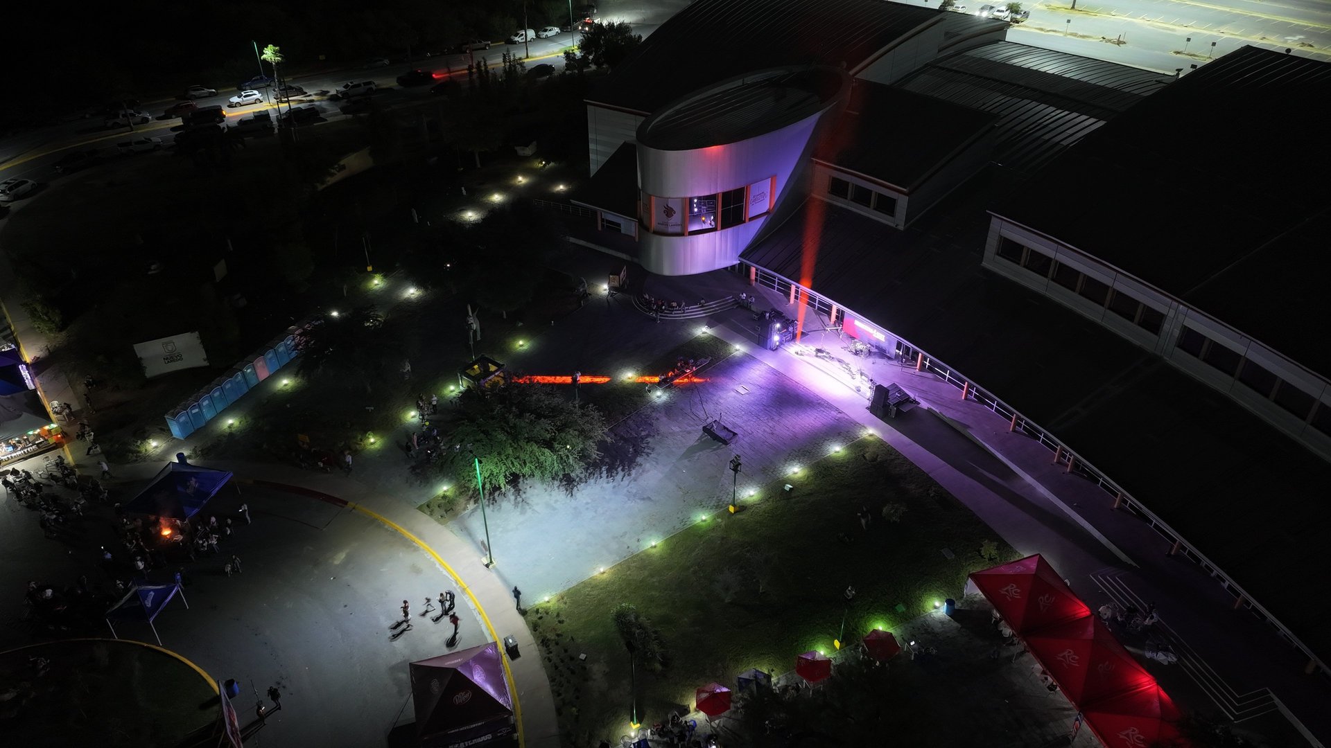 an abstract photo of a curved building with a blue sky in the background