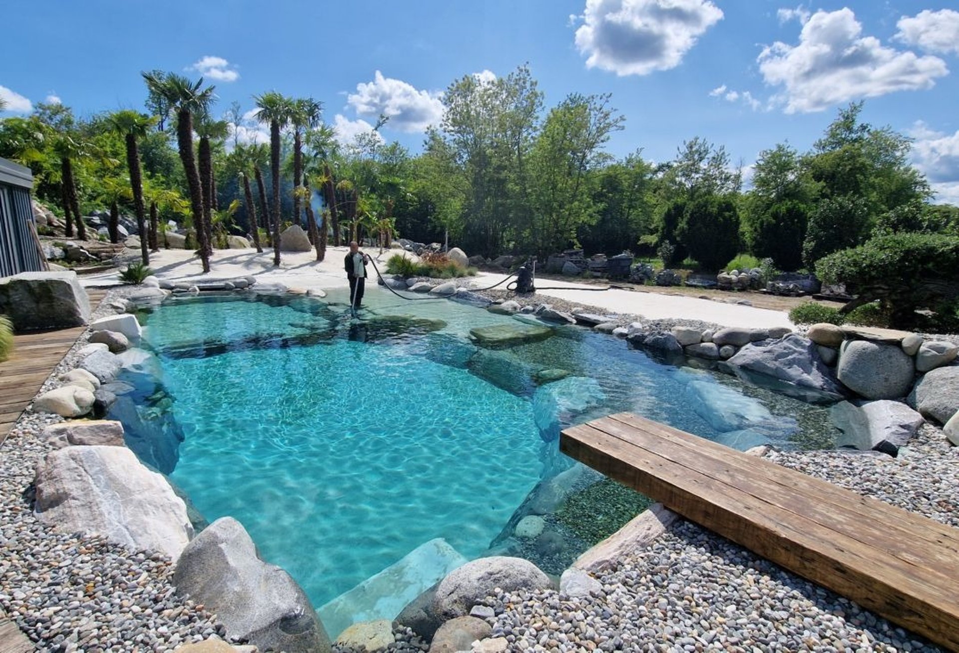 a modern house with a pool in front of it