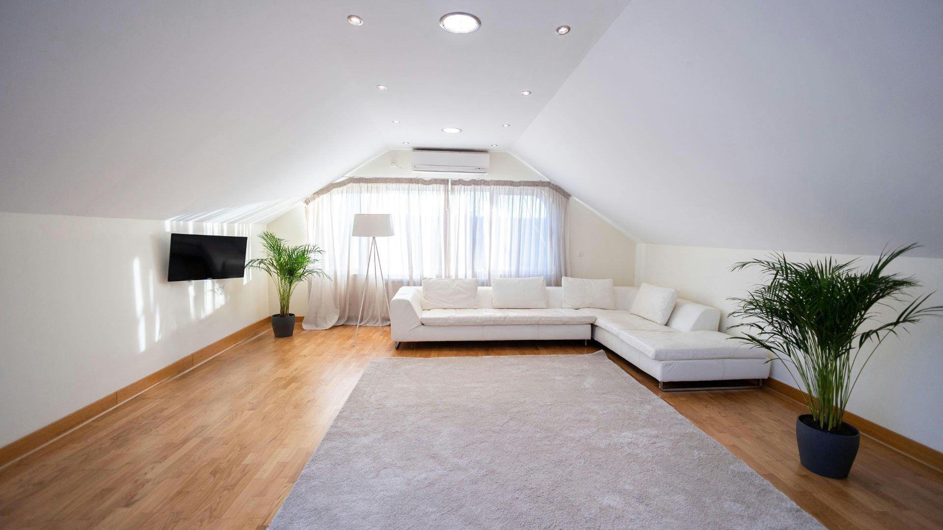 an abstract photo of a curved building with a blue sky in the background