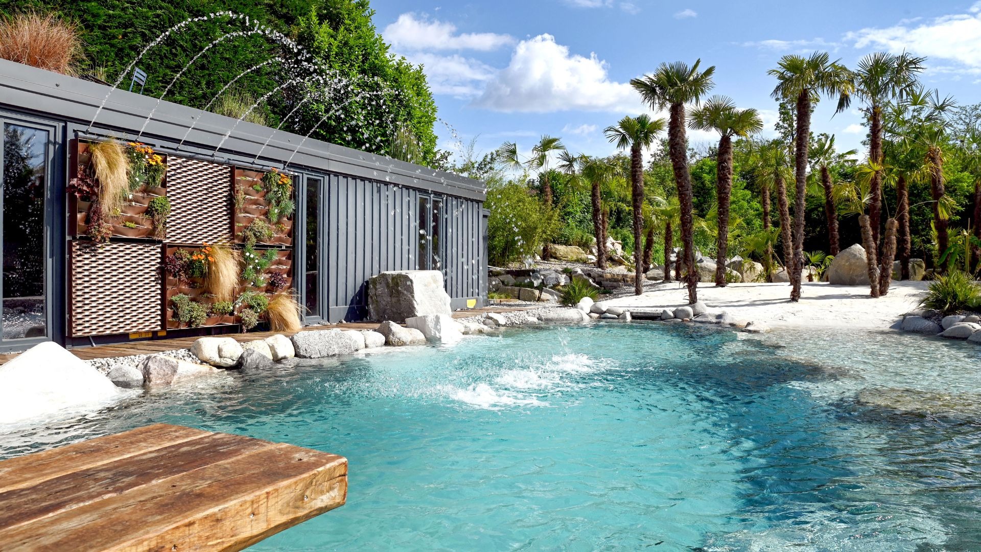 a modern house with a pool in front of it