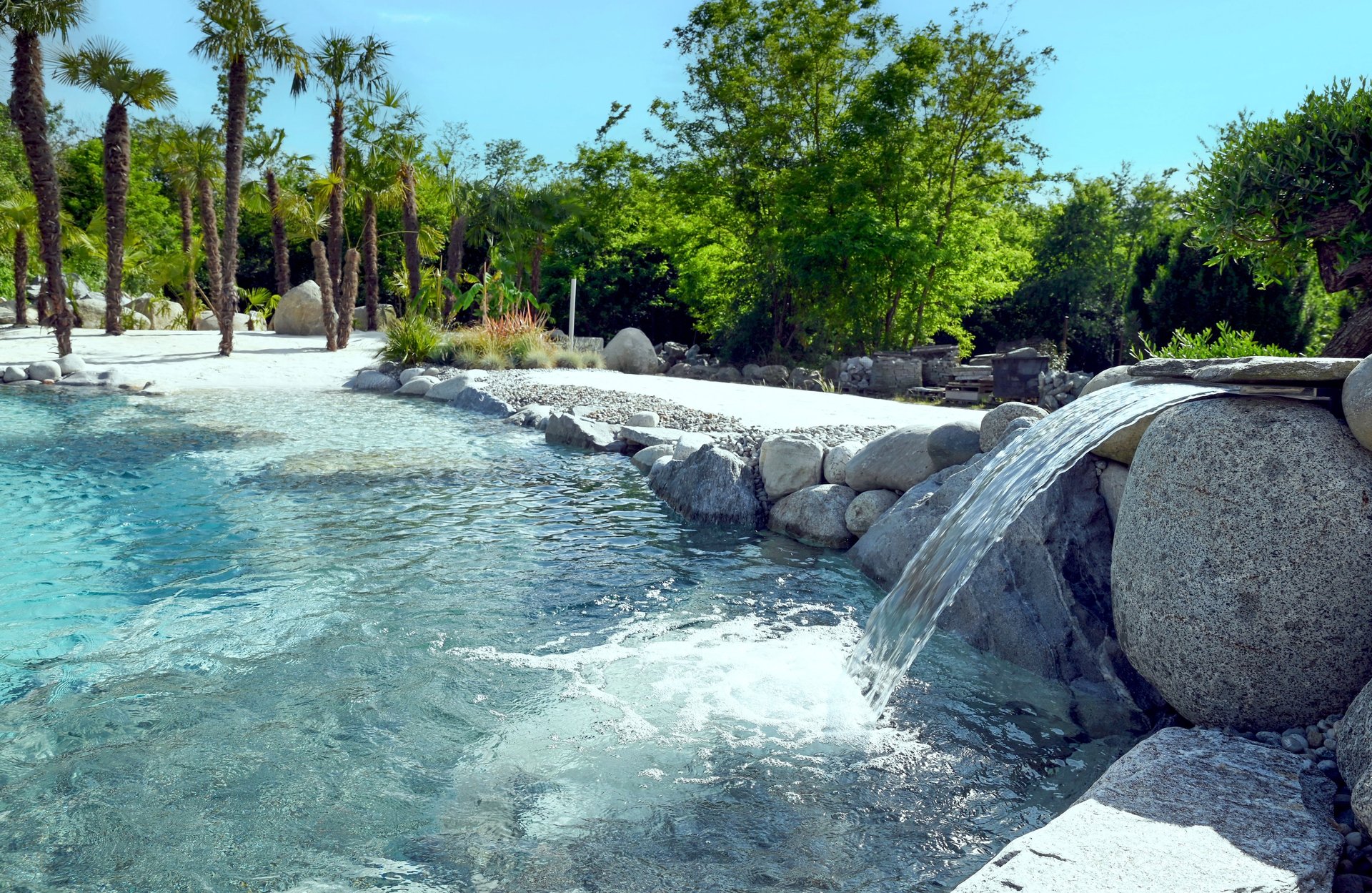 a small black cabin in the middle of a field