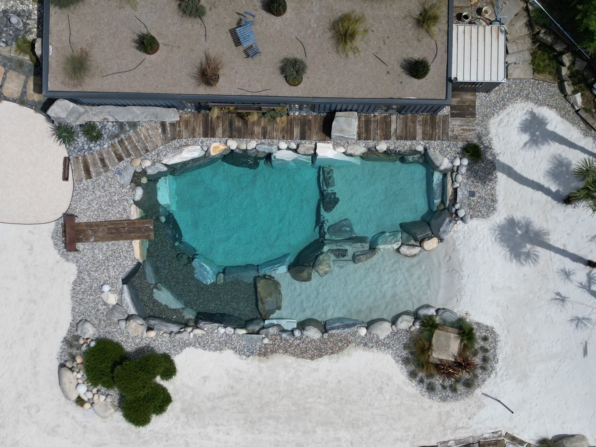 a rendering of a modern house in the middle of a grassy area