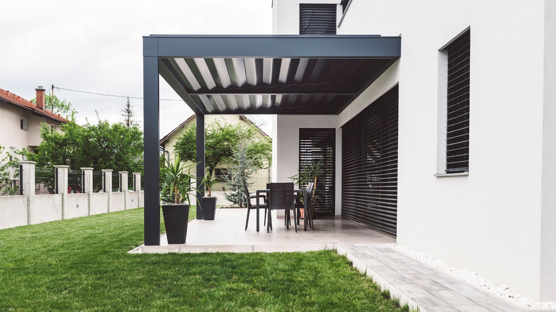 an abstract photo of a curved building with a blue sky in the background