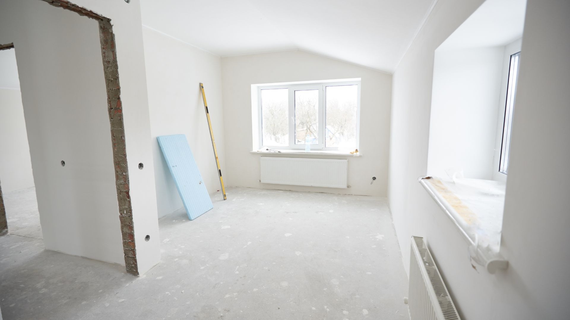 an abstract photo of a curved building with a blue sky in the background
