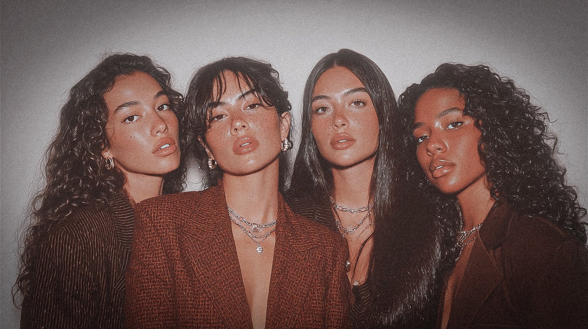 an abstract photo of a curved building with a blue sky in the background