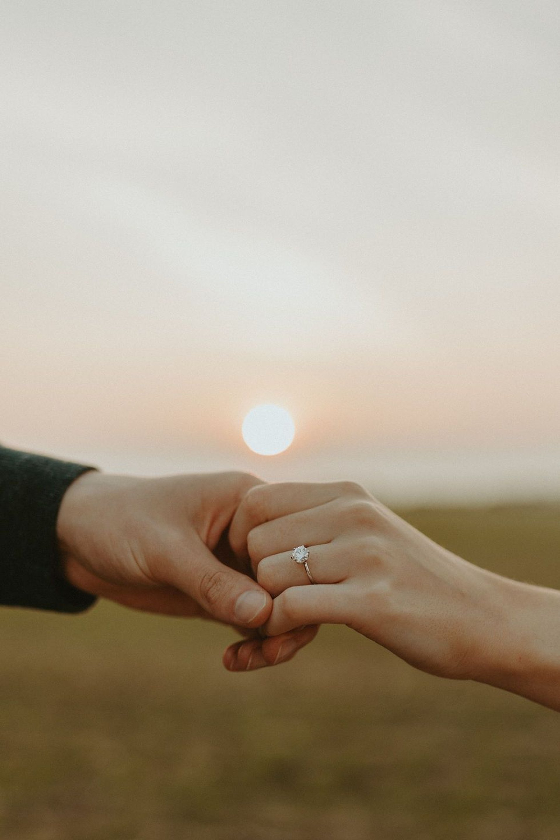 couple wearing silver-colored rings