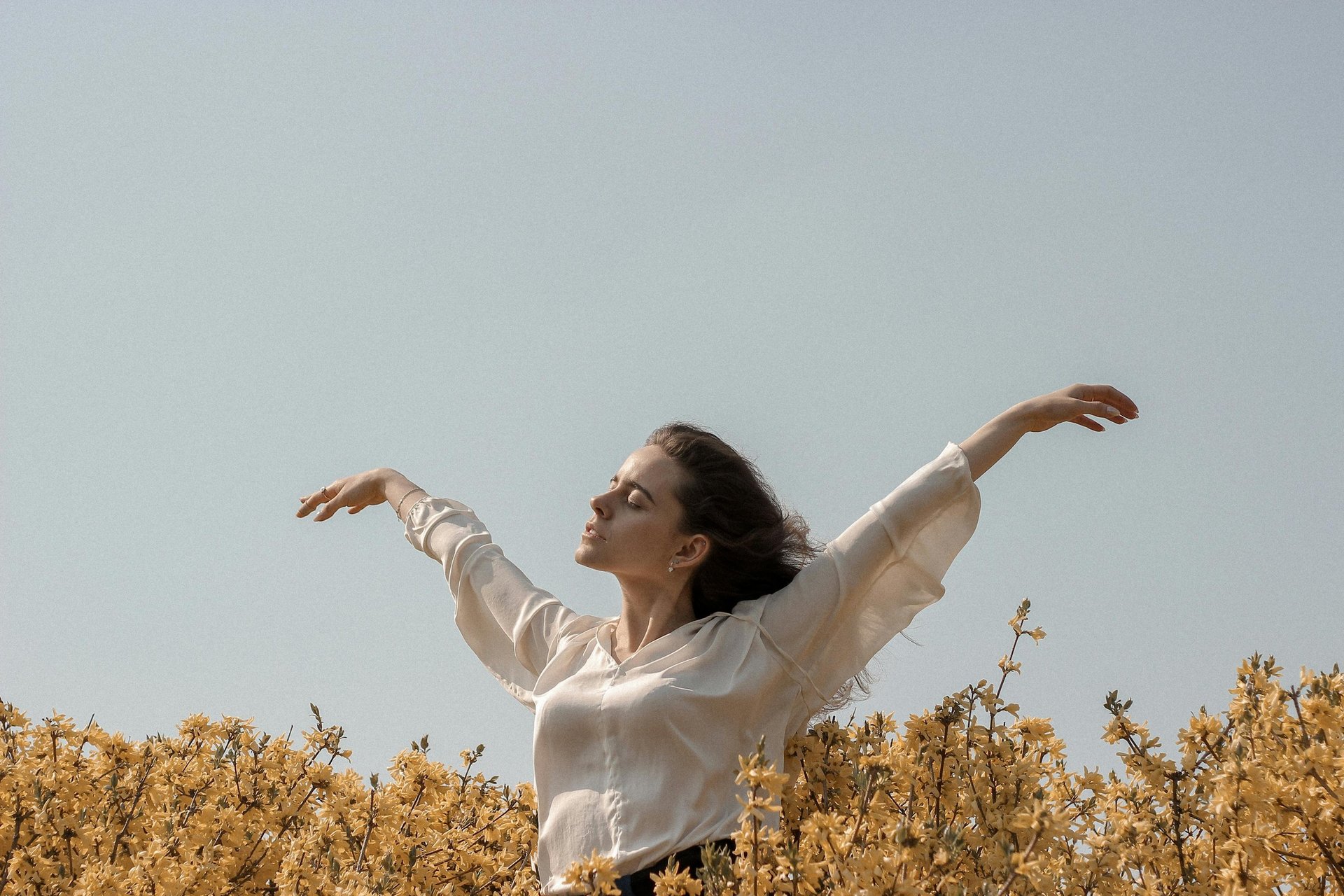 woman sitting on hill