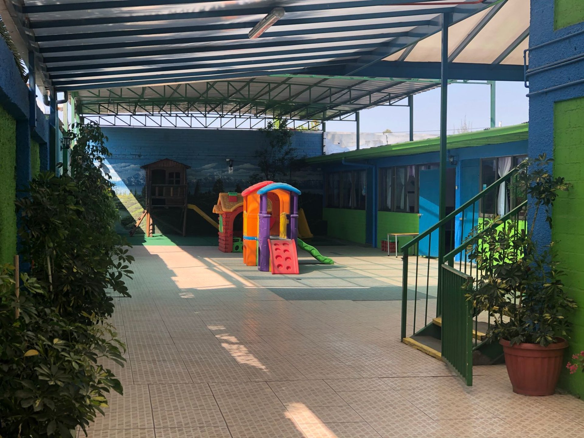 an abstract photo of a curved building with a blue sky in the background