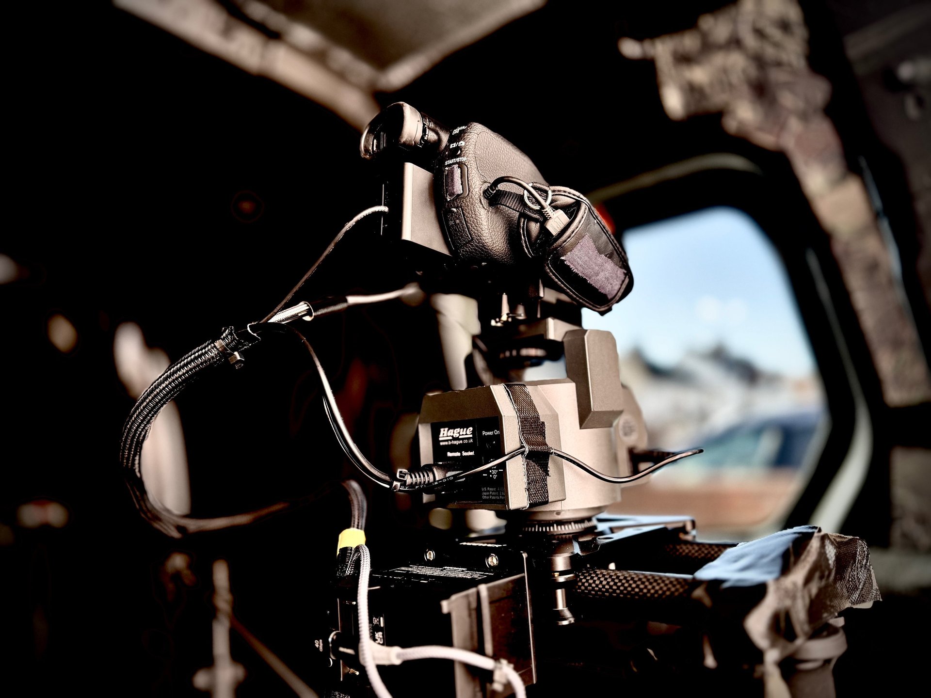 an abstract photo of a curved building with a blue sky in the background
