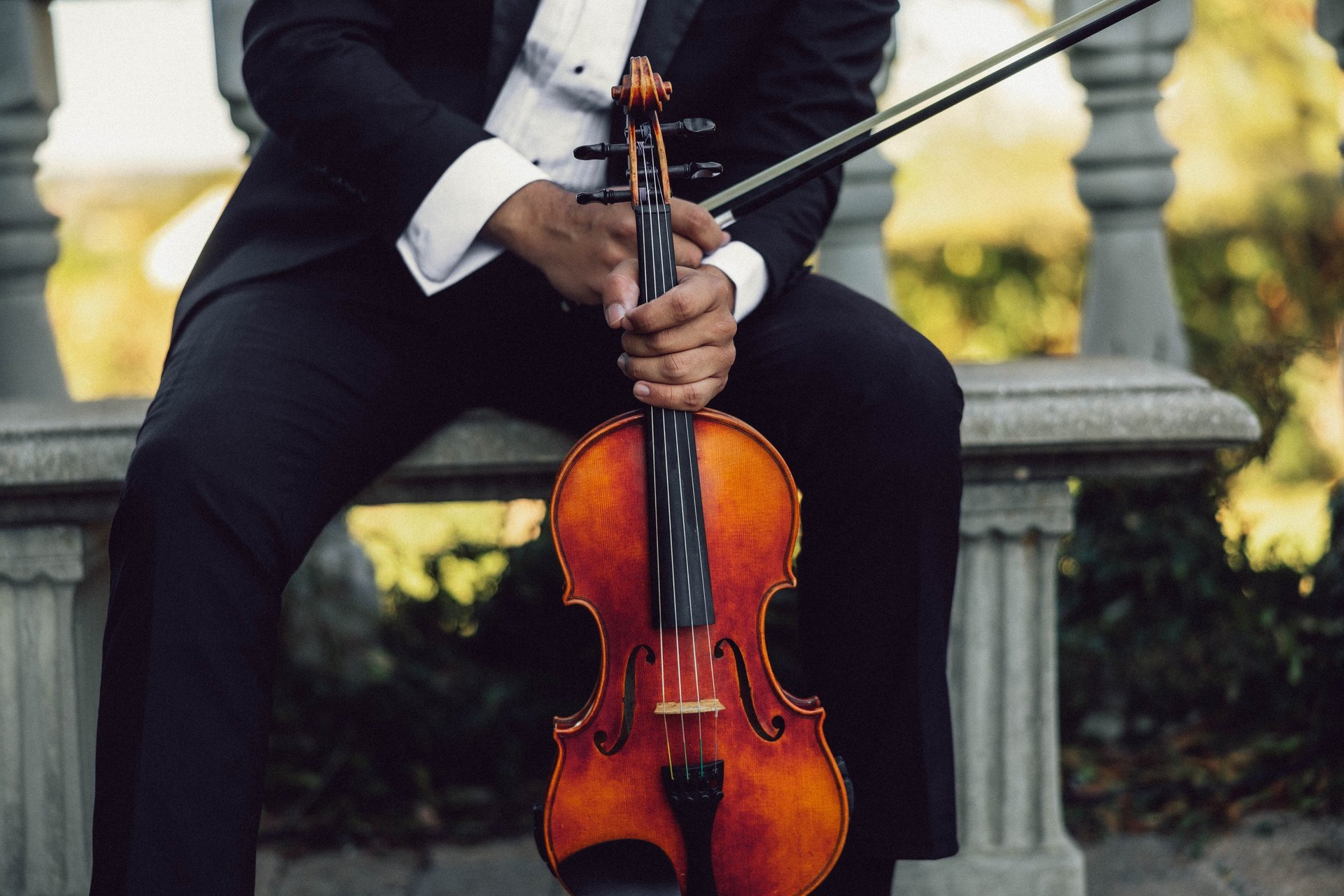 A lamp and salt shakers sit on a restaurant table.