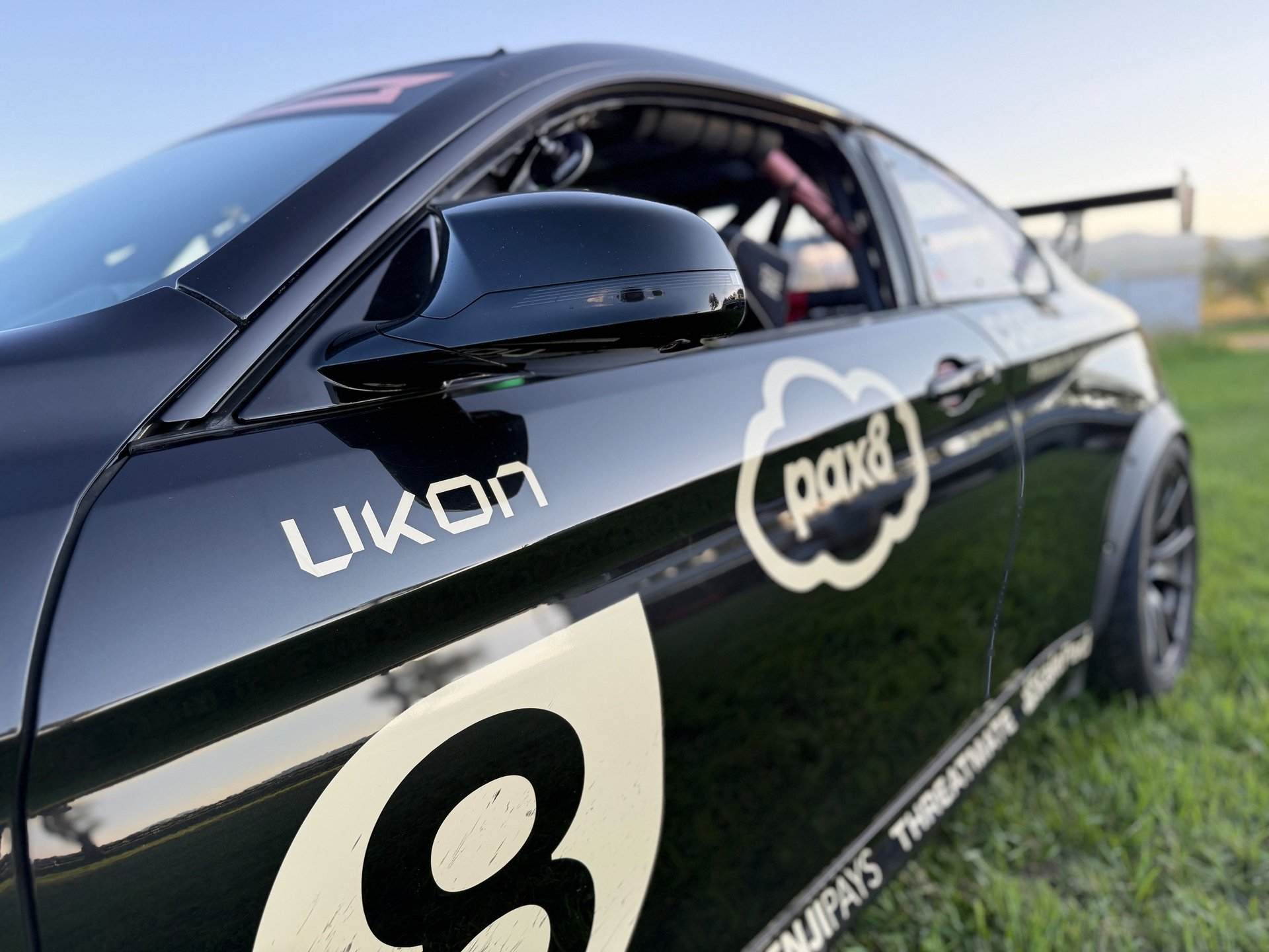 an abstract photo of a curved building with a blue sky in the background