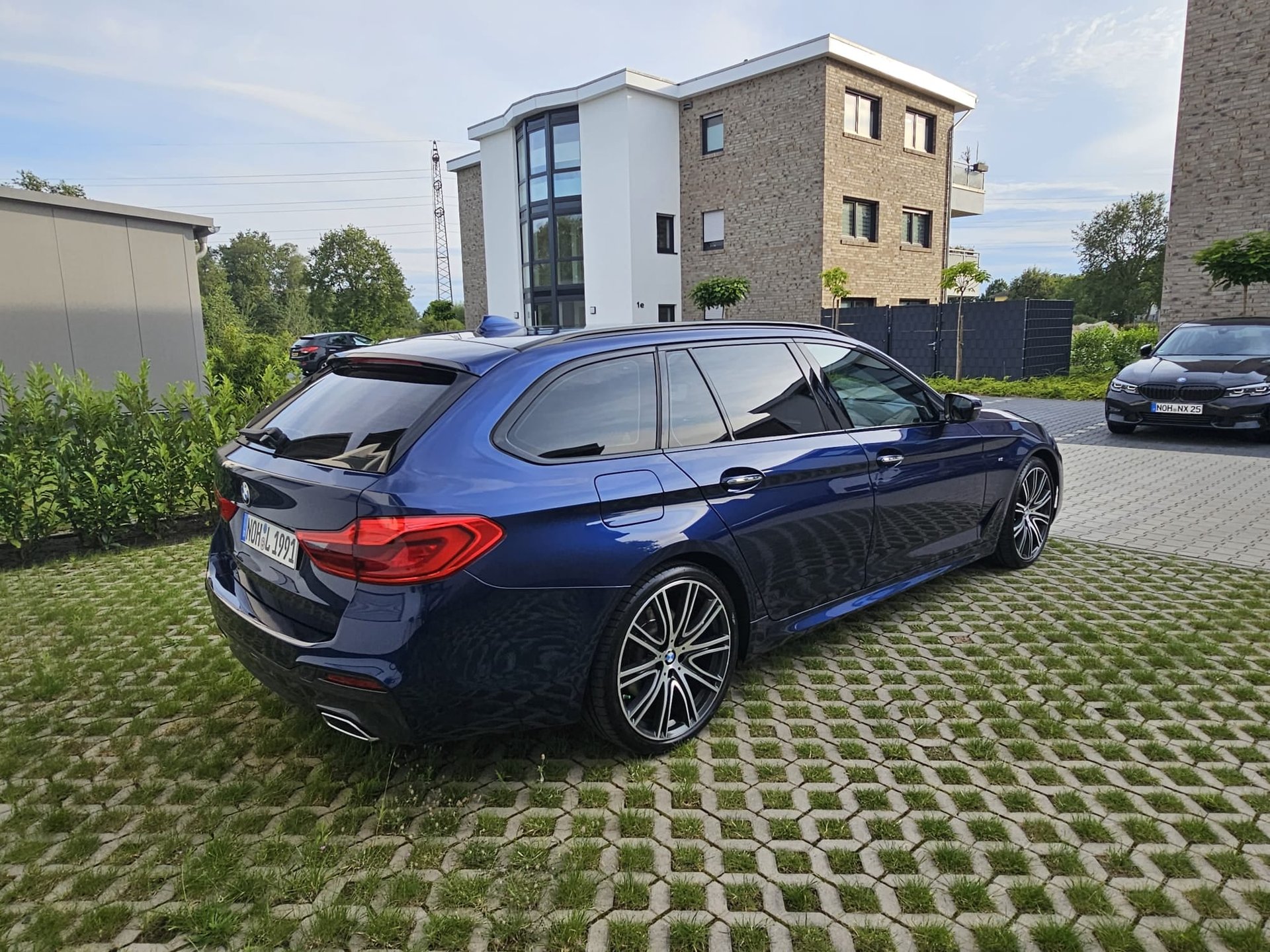 an abstract photo of a curved building with a blue sky in the background