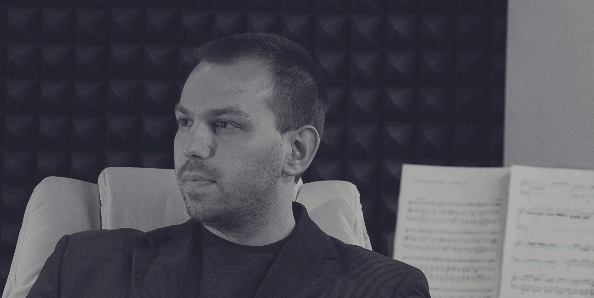 an abstract photo of a curved building with a blue sky in the background