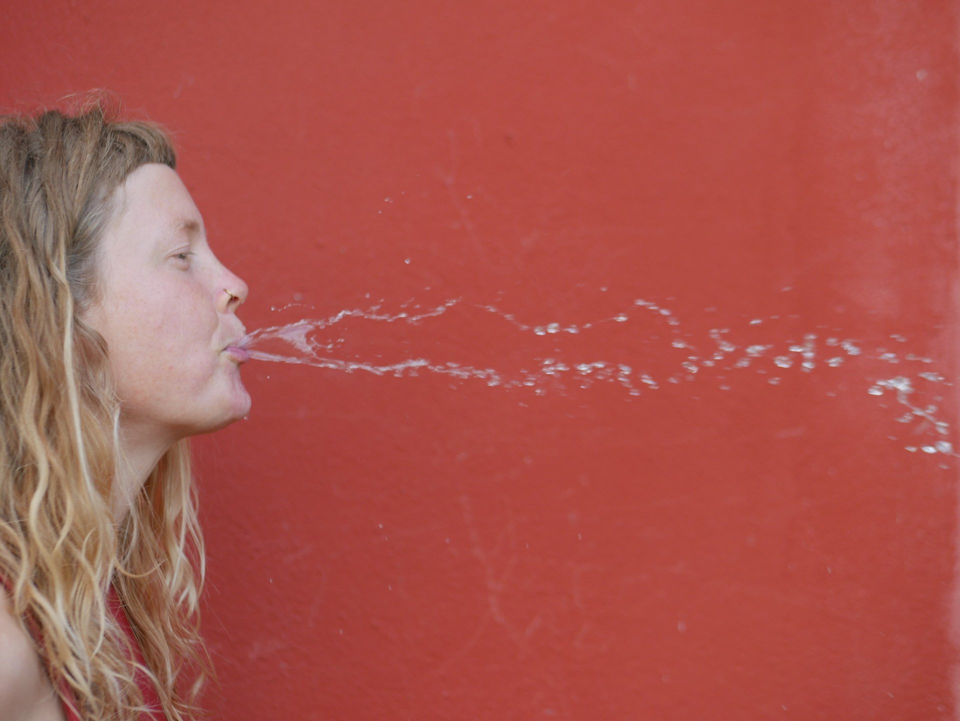 an abstract photo of a curved building with a blue sky in the background