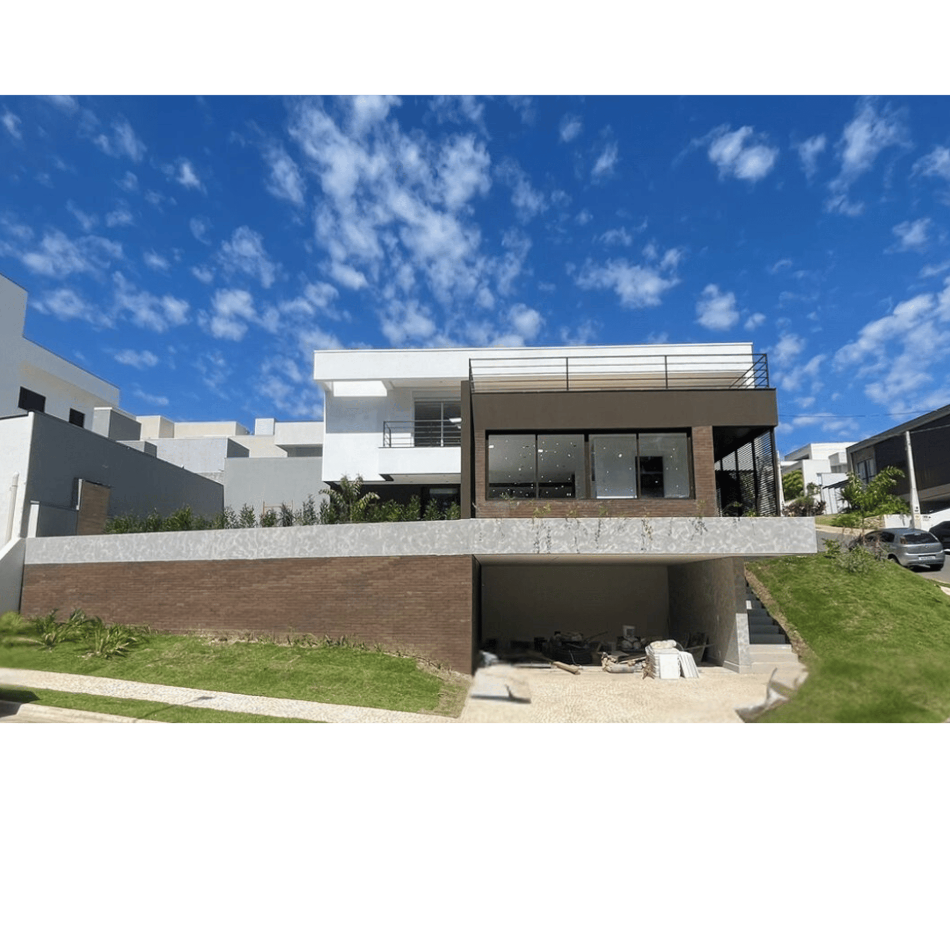 an abstract photo of a curved building with a blue sky in the background