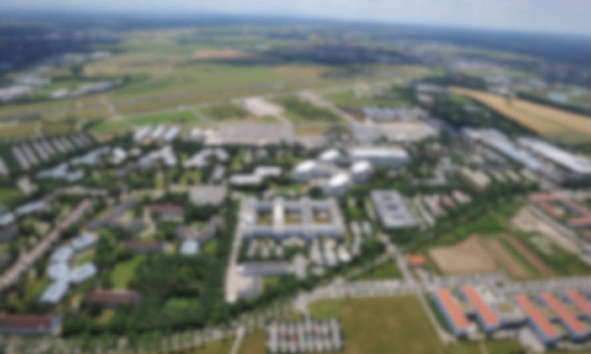 an abstract photo of a curved building with a blue sky in the background