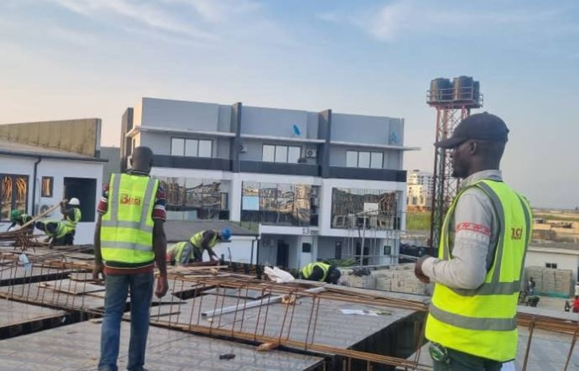 people working on building during daytime