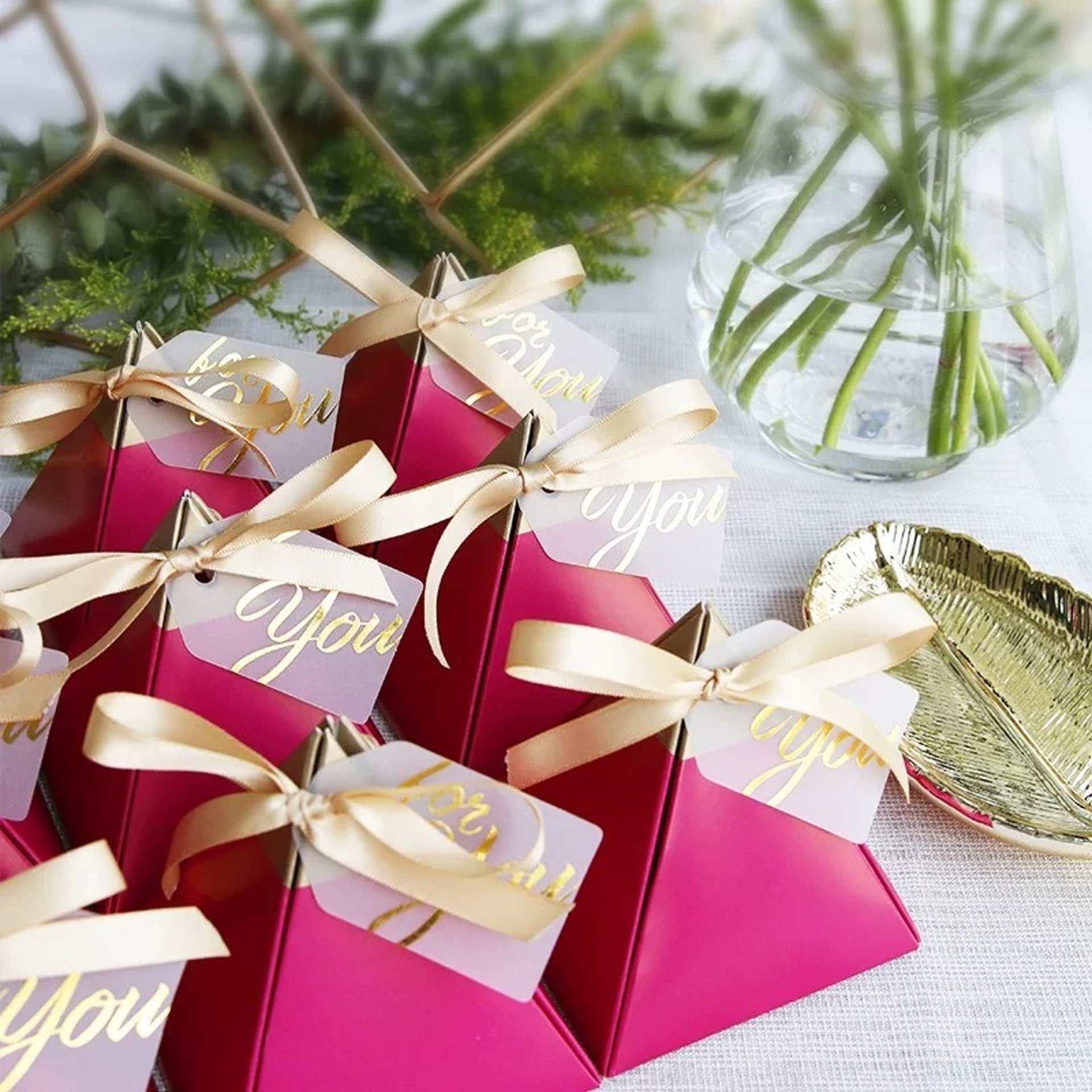 pink and green flower on brown paper