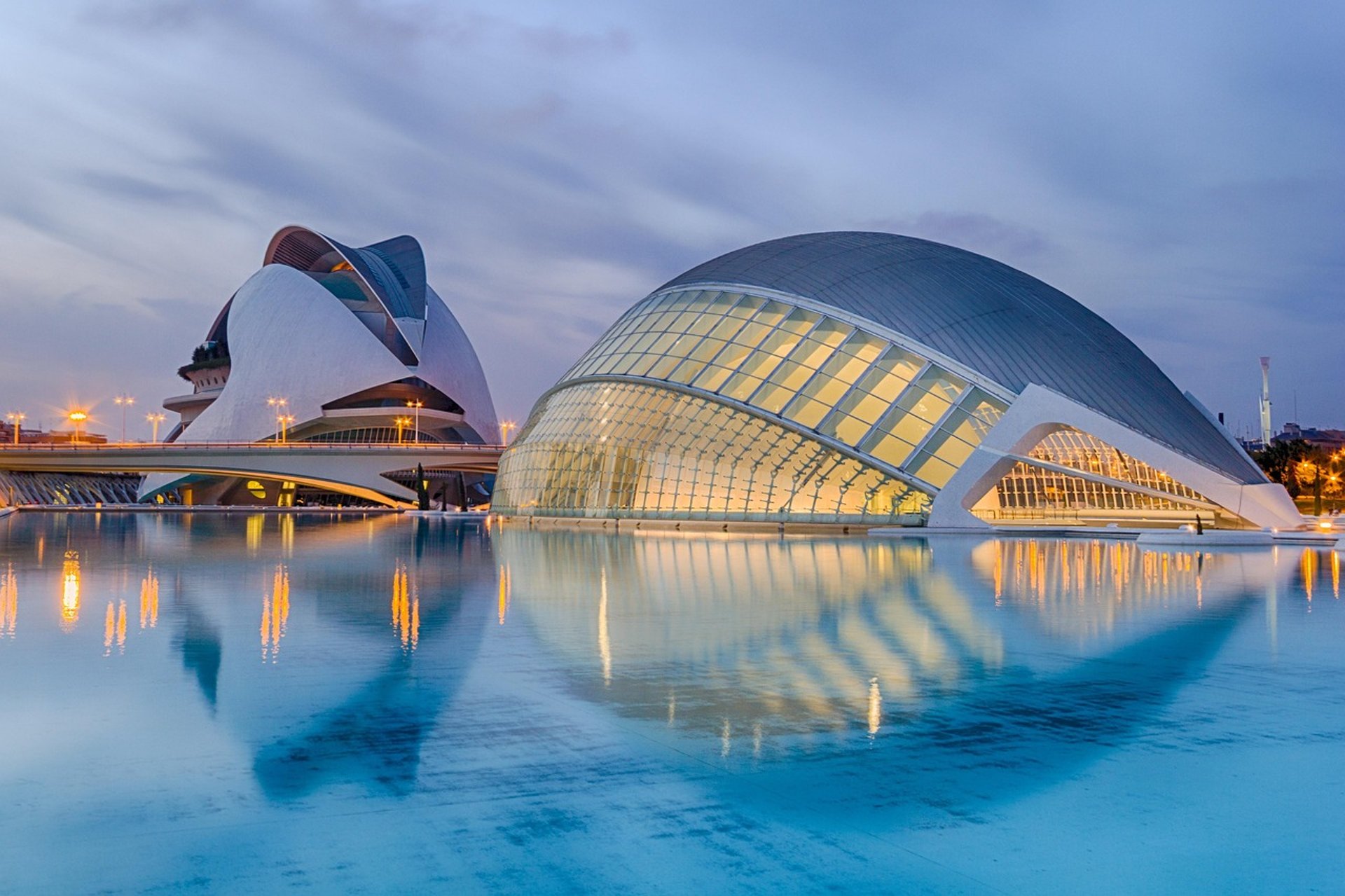 an abstract photo of a curved building with a blue sky in the background
