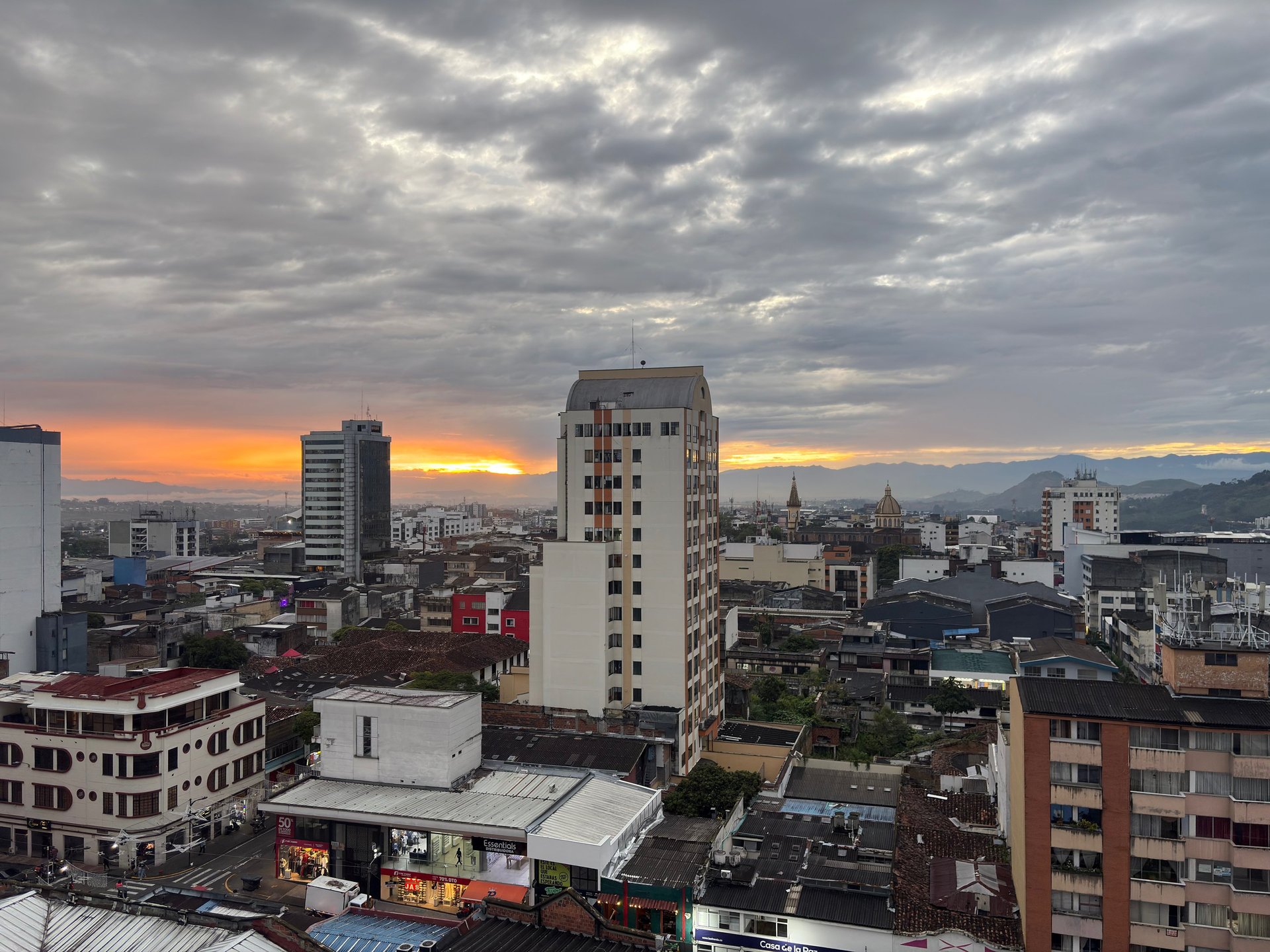 an abstract photo of a curved building with a blue sky in the background
