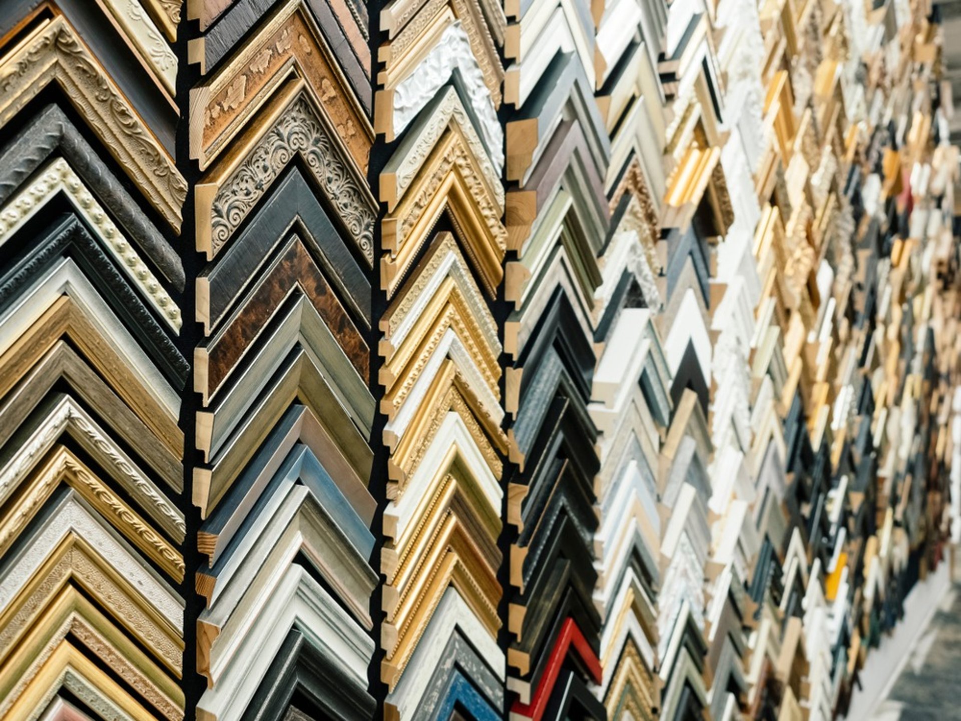 assorted-color framed paintings on the wall