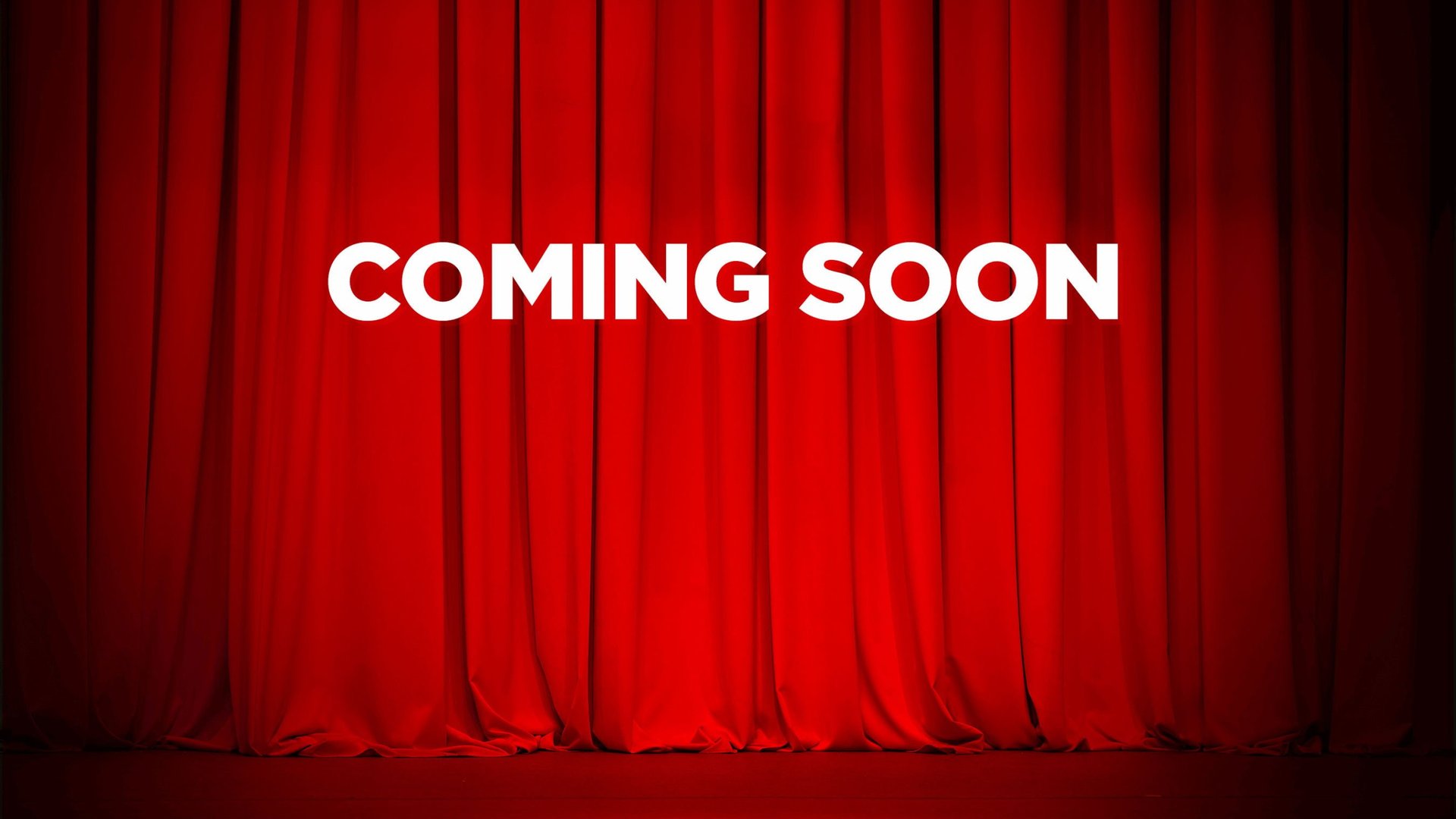 a black and white photo of a sign that says coming soon