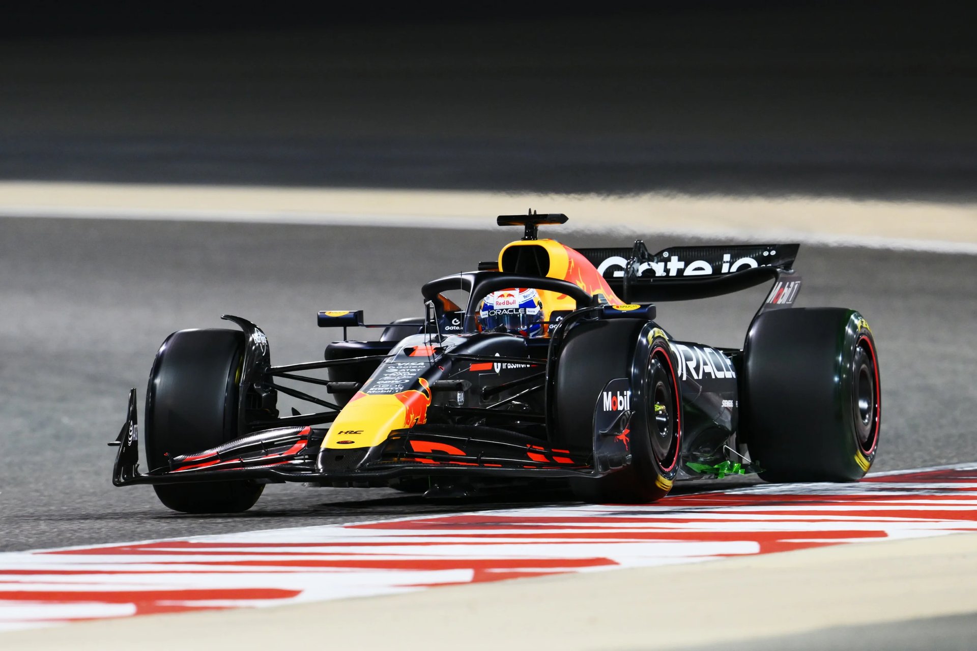 A race car is driving on the track.