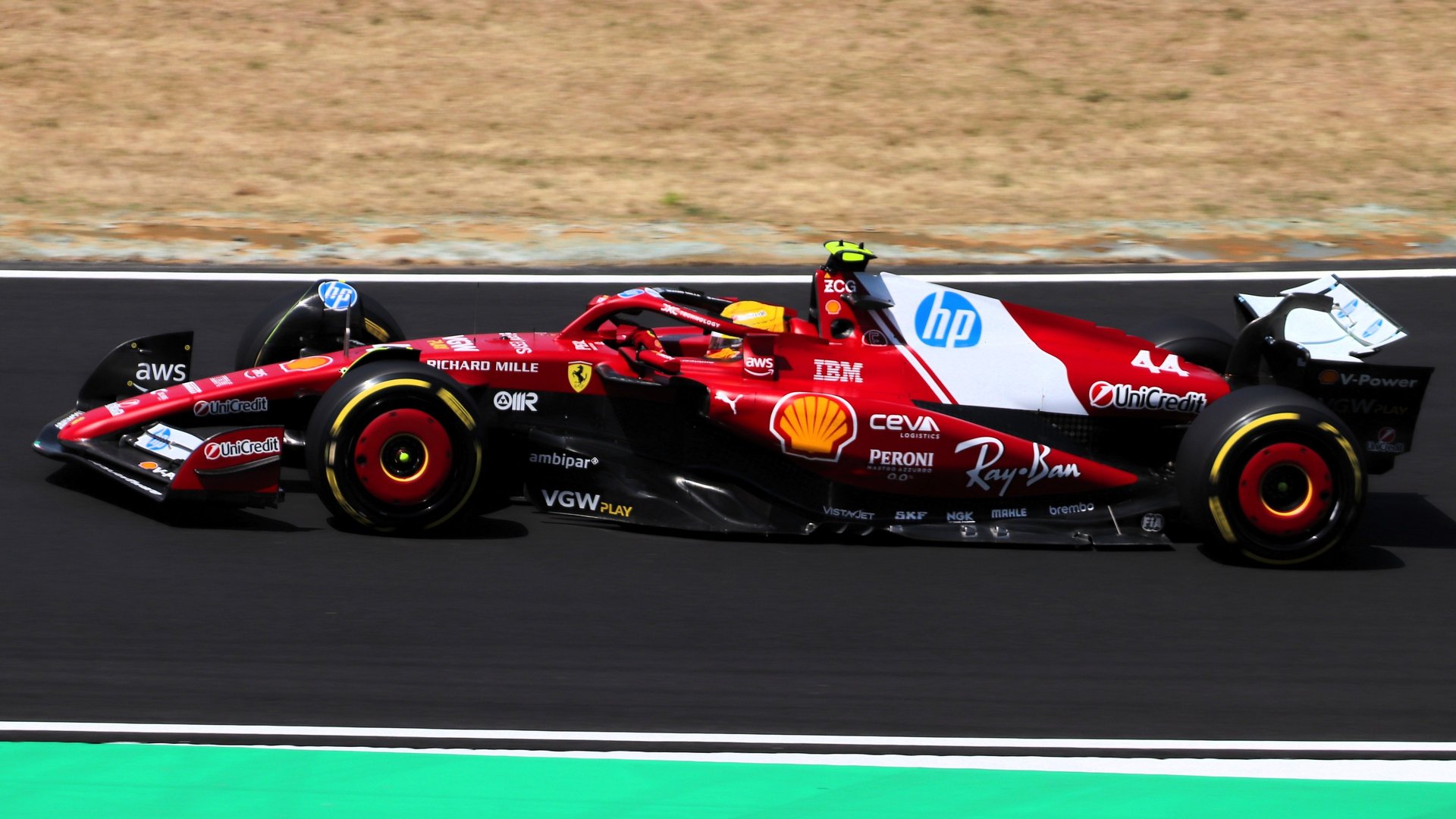 A formula 1 car speeds around a racetrack.