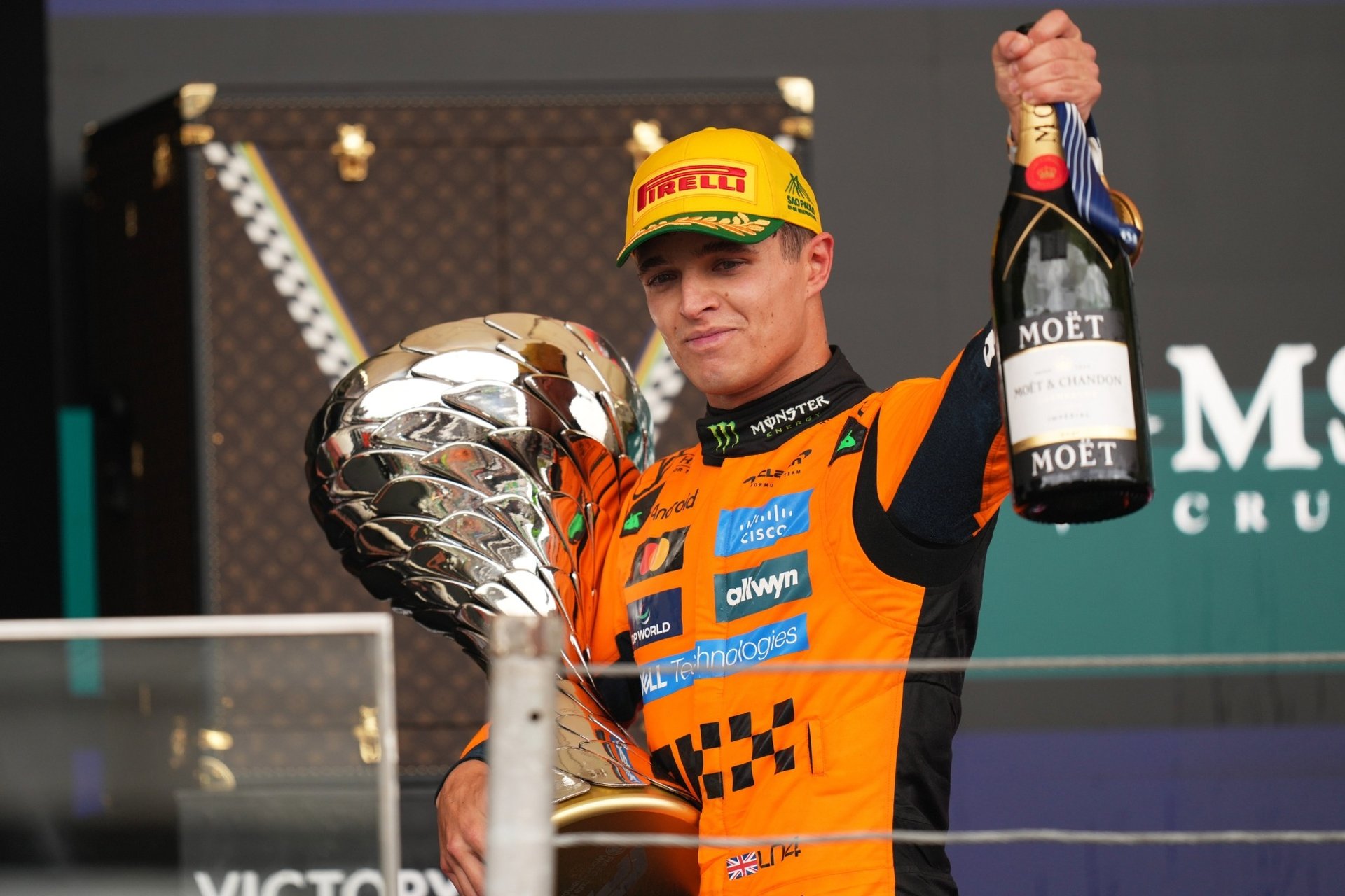 a group of people standing around a car in a garage