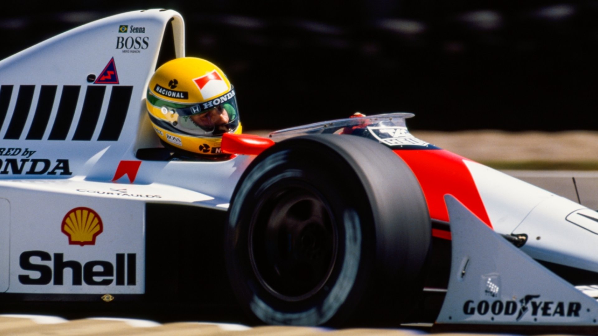 a close up of a yellow race car
