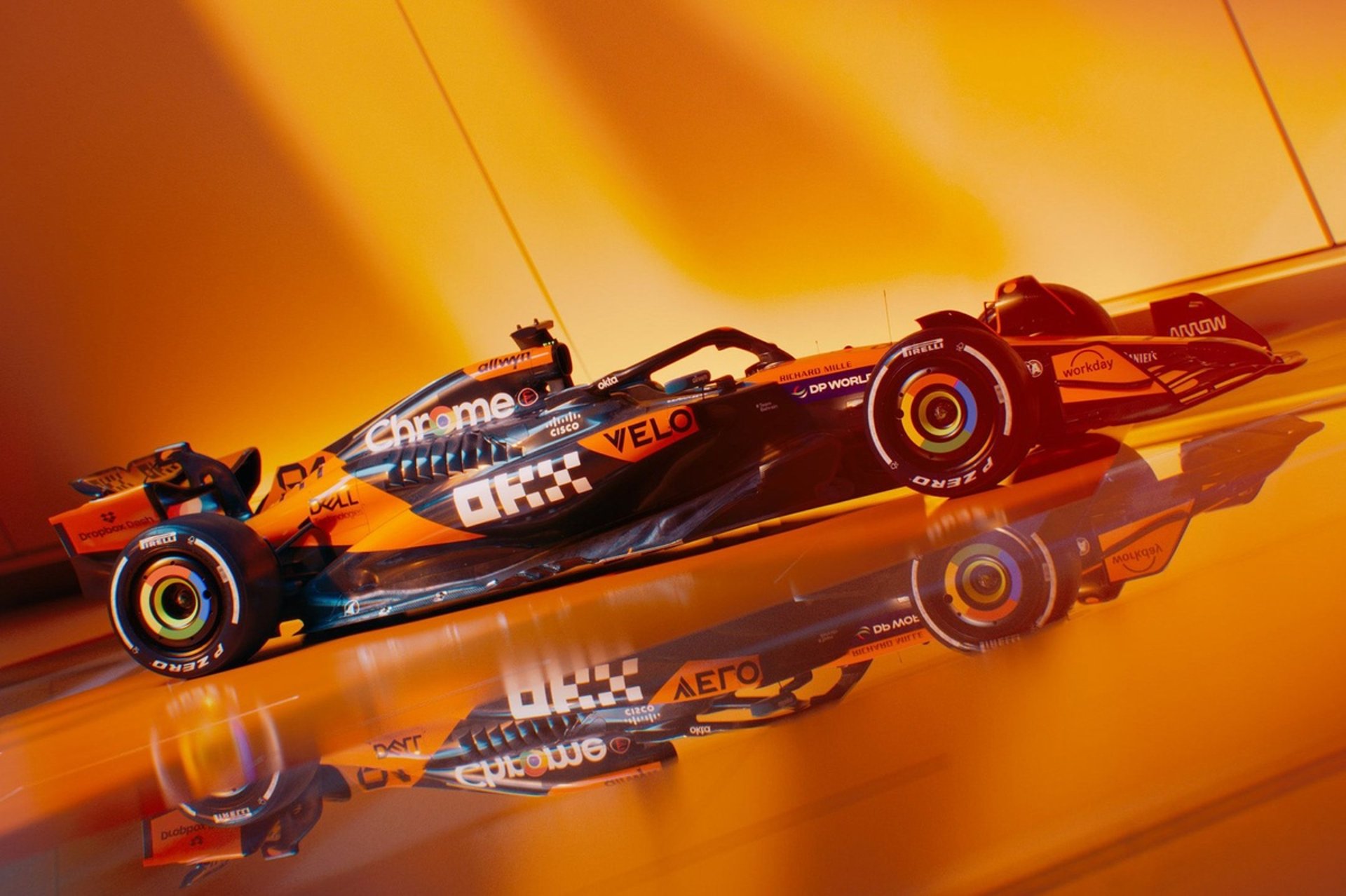 a close up of a toy race car on a white surface