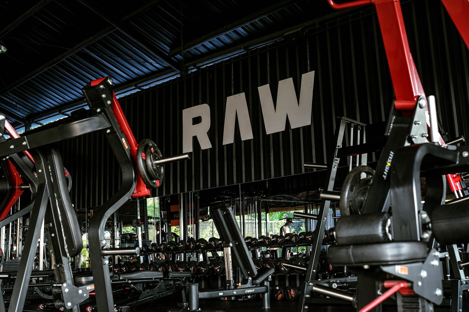a gym with rows of exercise equipment