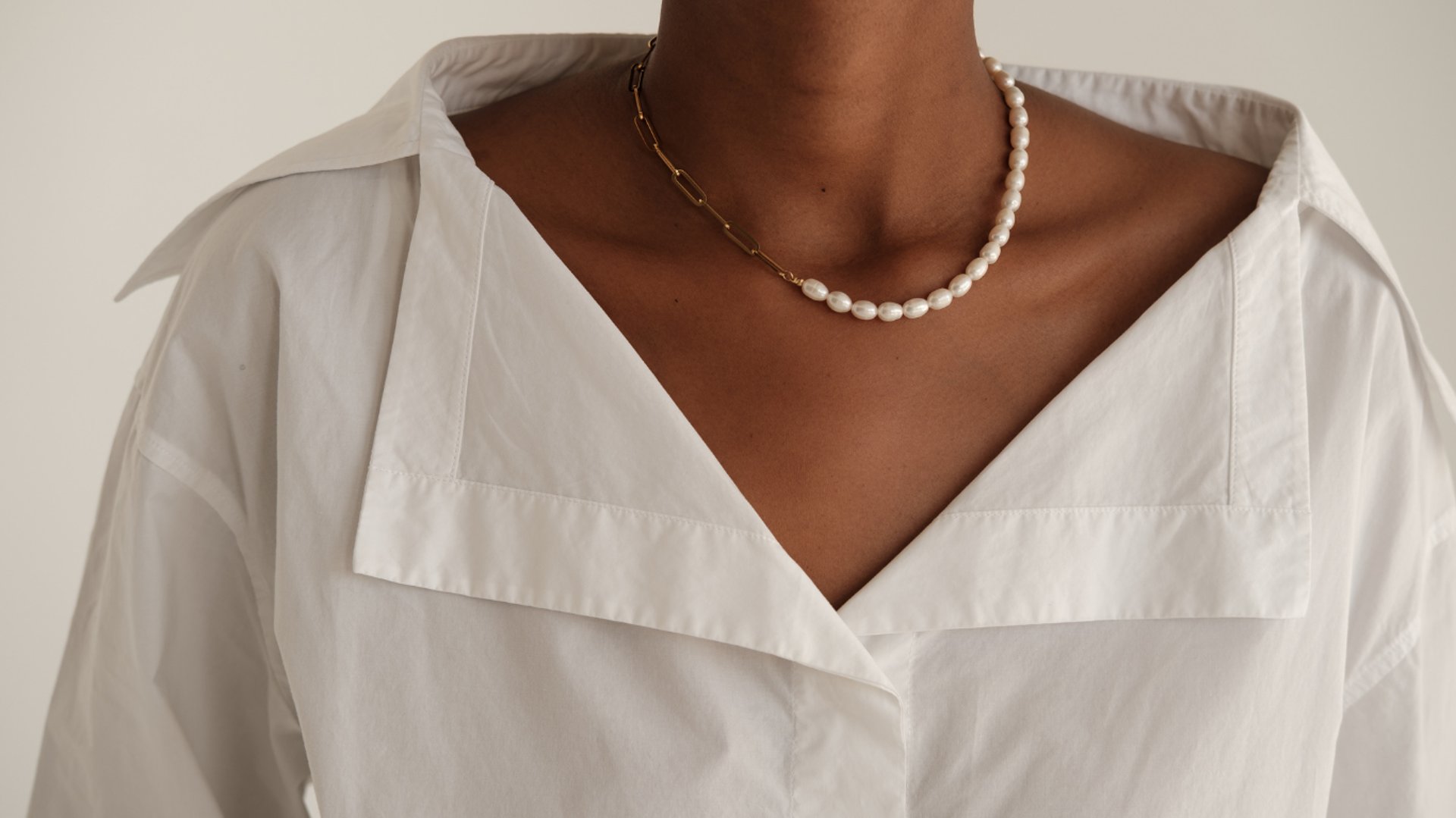 an abstract photo of a curved building with a blue sky in the background