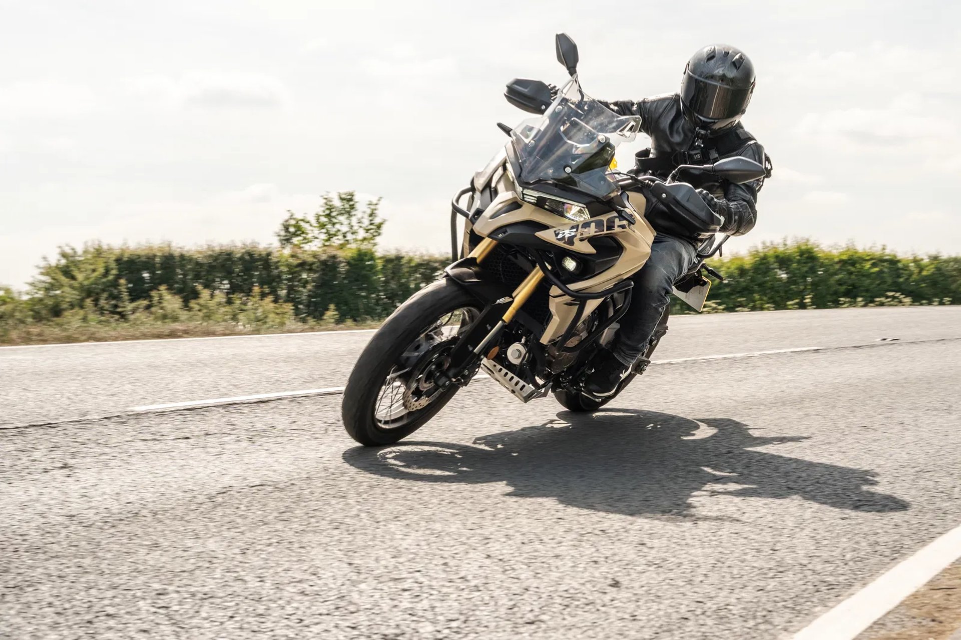 person jumping to body of water during daytime