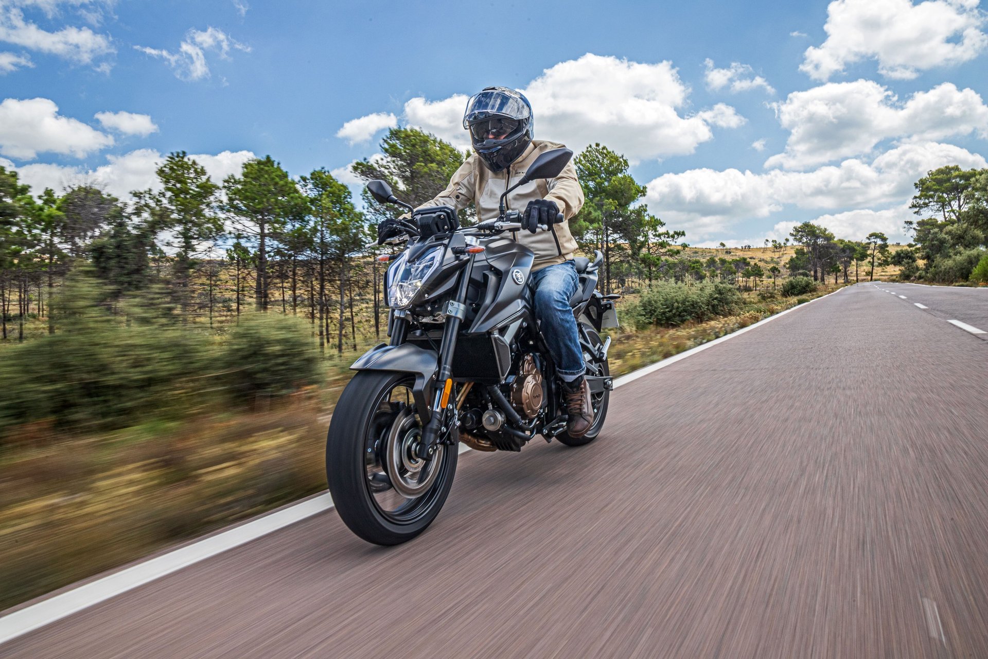 person jumping to body of water during daytime