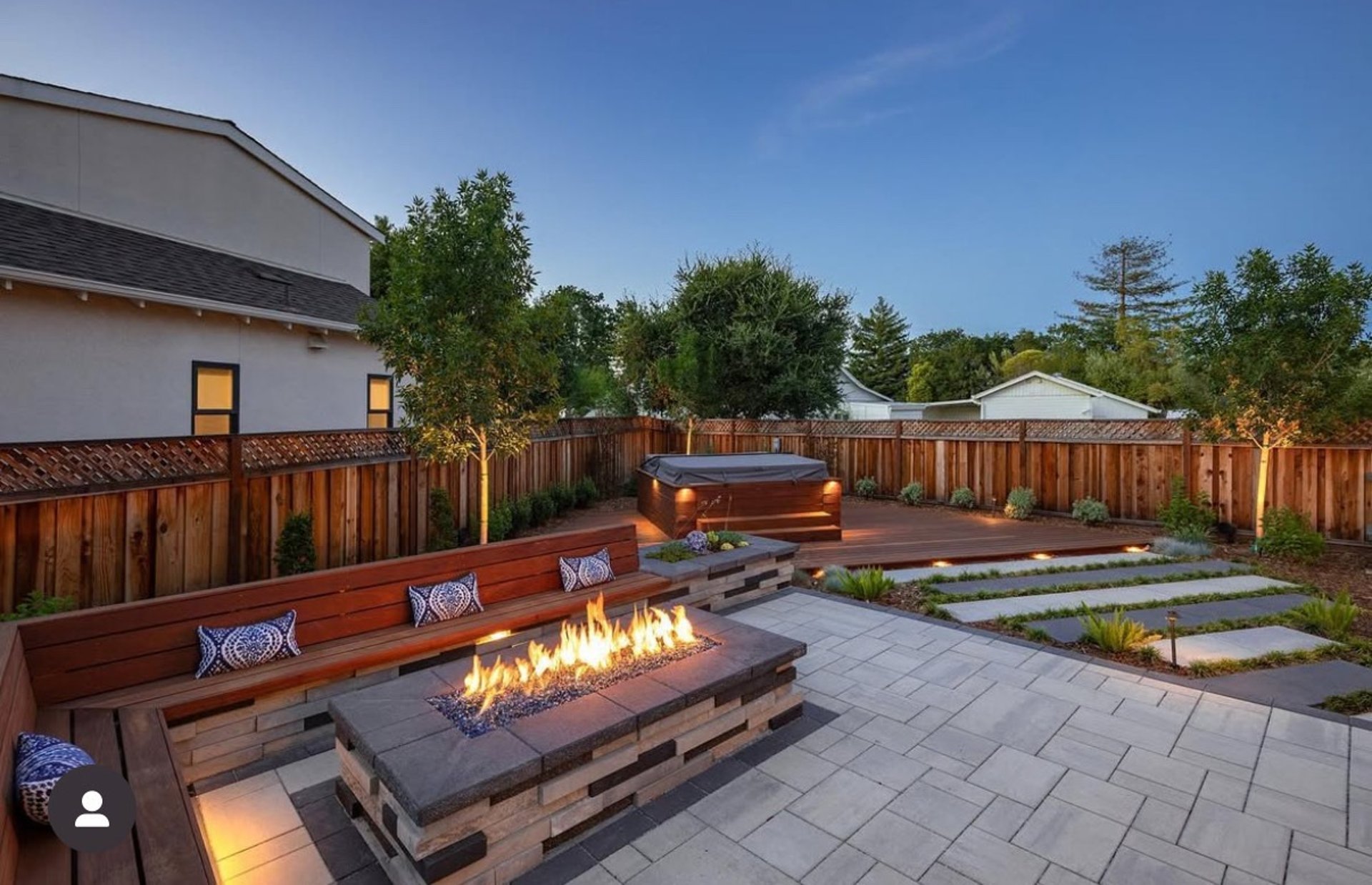 Custom-built luxury pool in Atherton with stone decking, integrated spa, and modern LED lighting