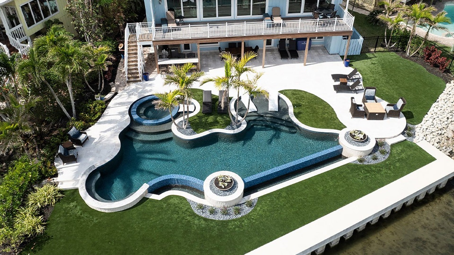 Custom-built luxury pool in Atherton with stone decking, integrated spa, and modern LED lighting