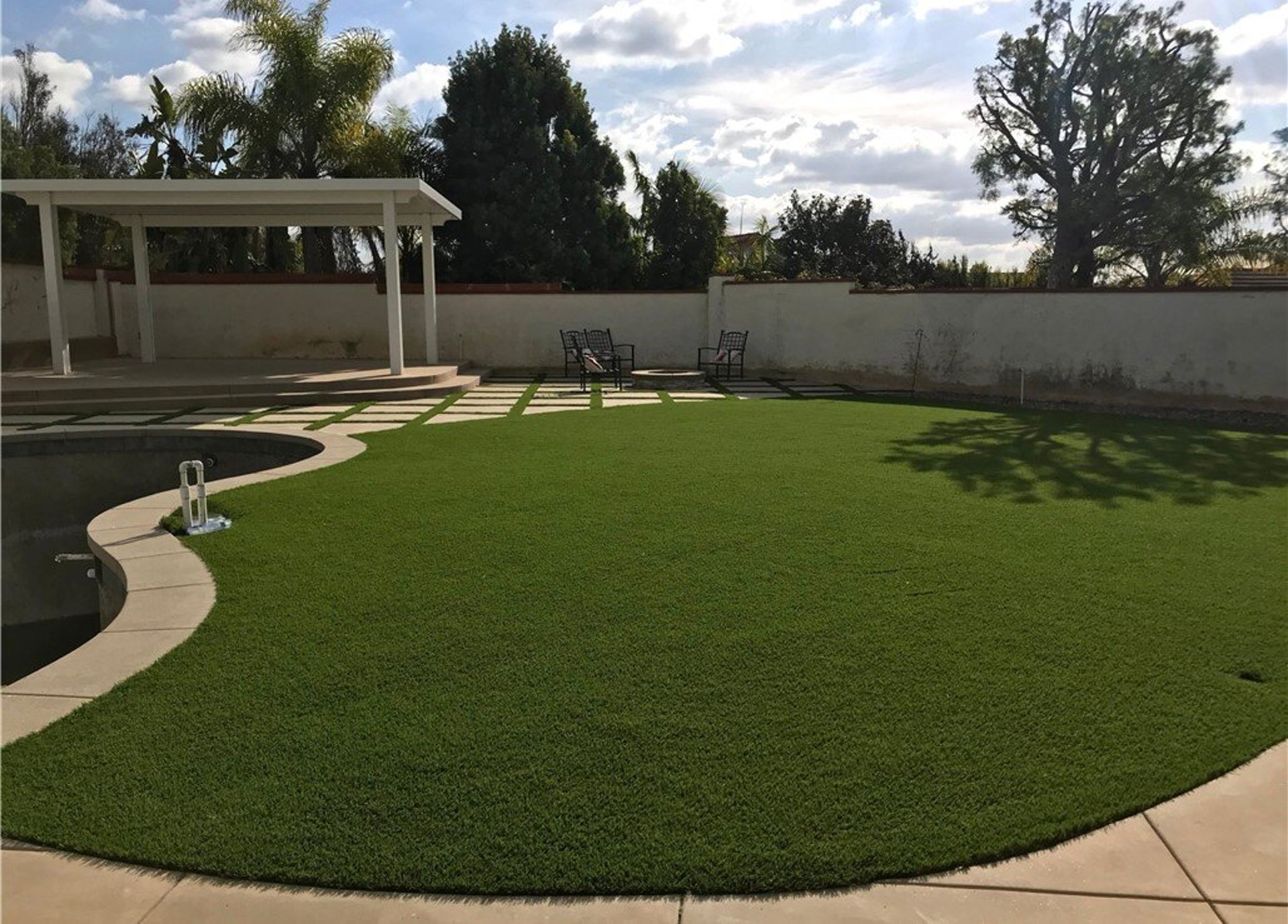 Atherton turf installers completing a lawn-to-turf backyard transformation
