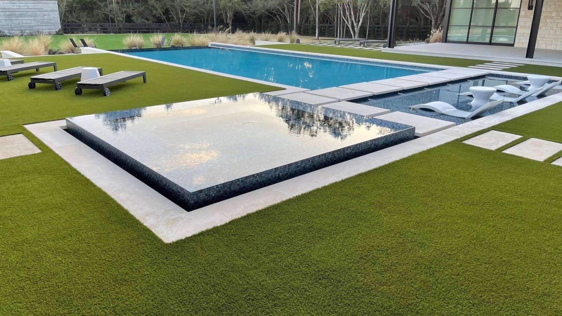 Artificial turf installation in Atherton backyard with clean, modern edging