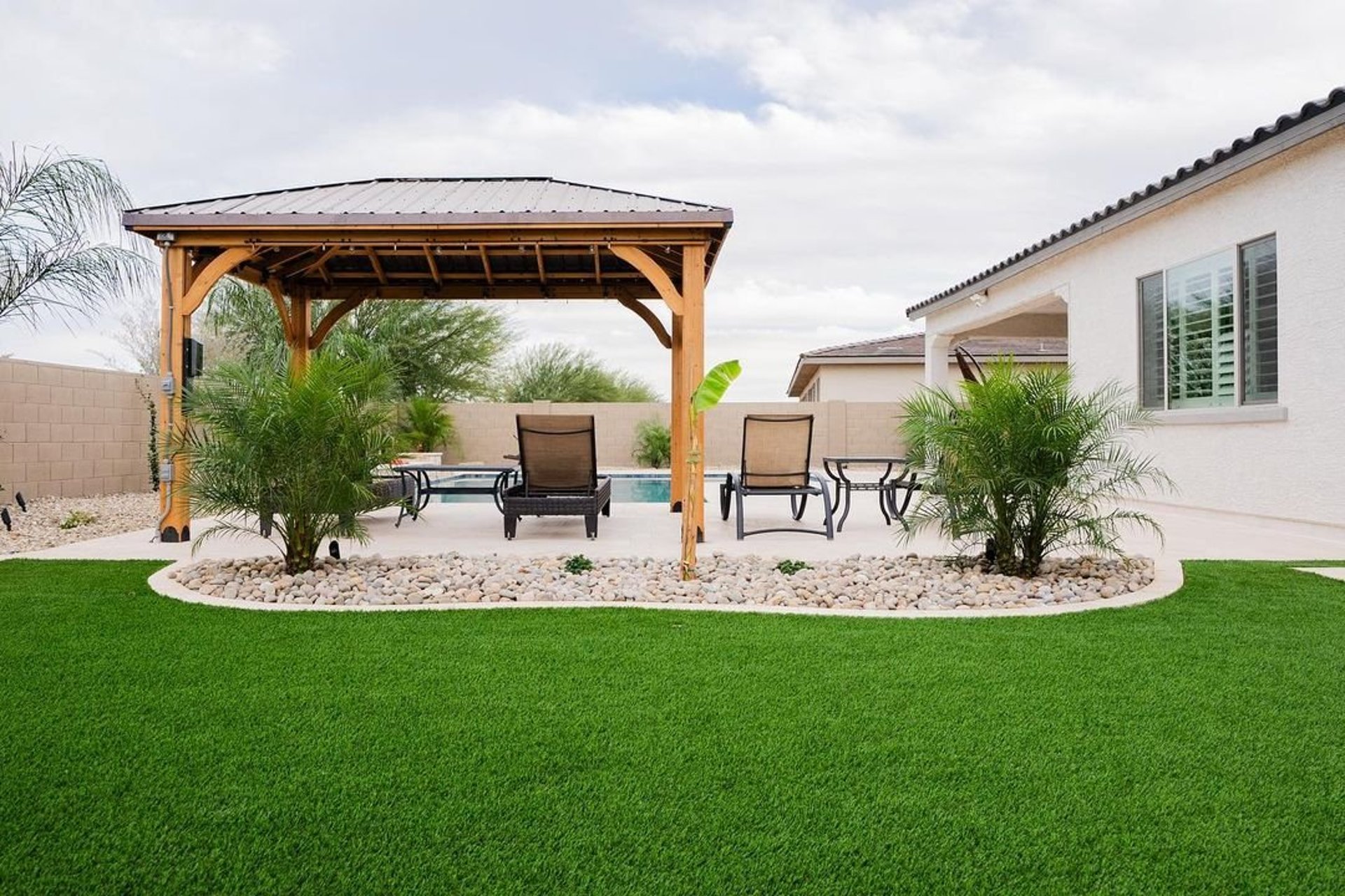 Artificial turf installation in Atherton backyard with clean, modern edging