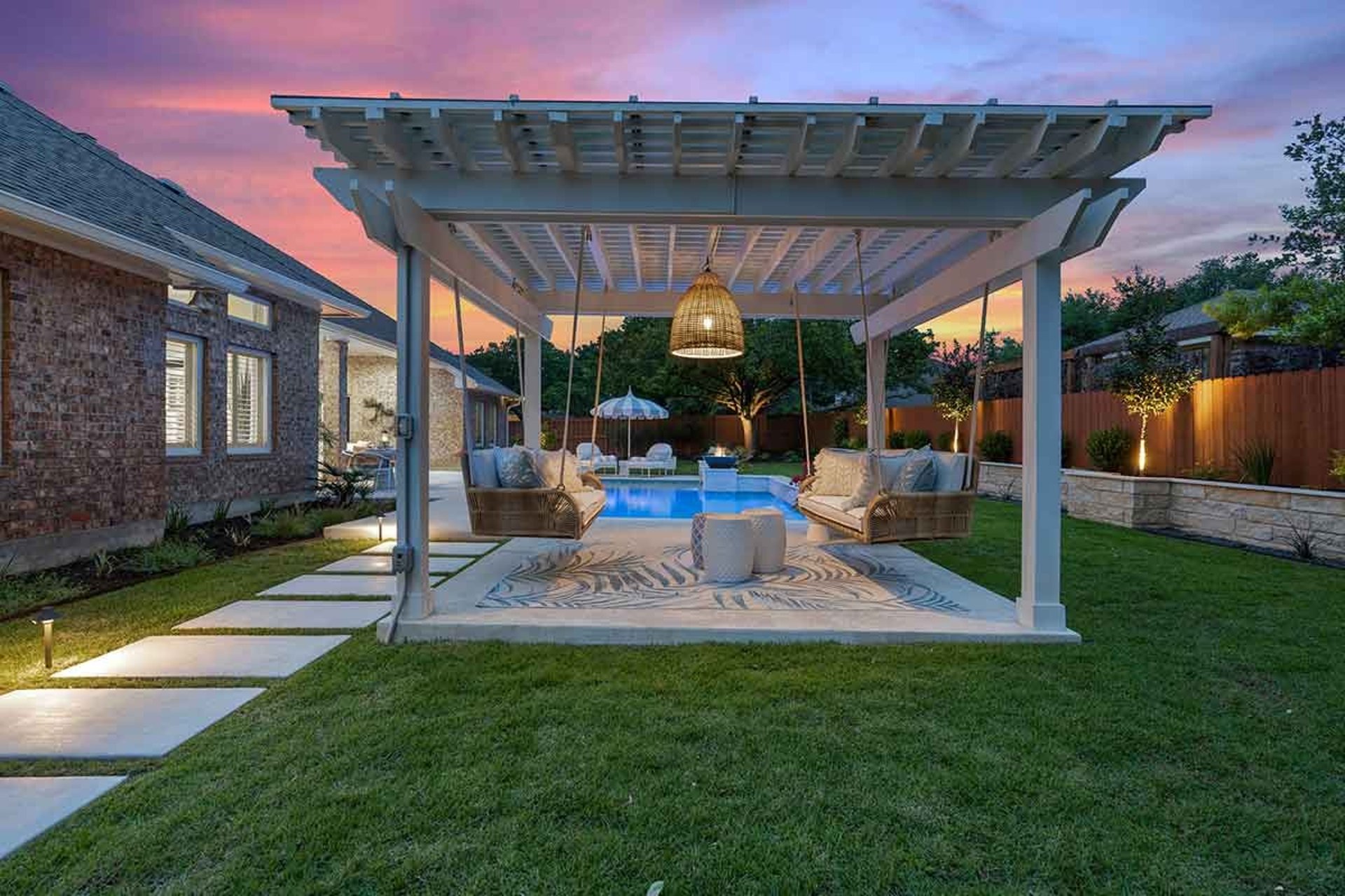 Luxury yard remodel in Atherton featuring drought-tolerant landscaping, custom patio, and outdoor living area