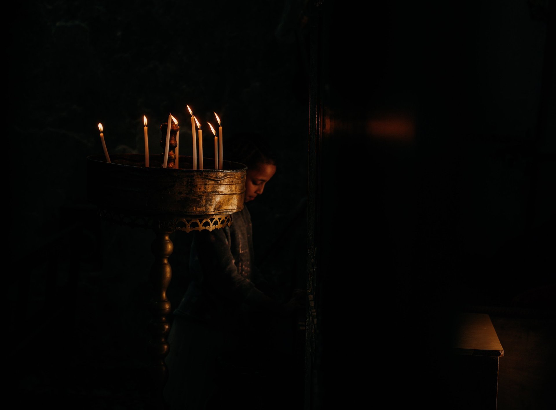 an abstract photo of a curved building with a blue sky in the background