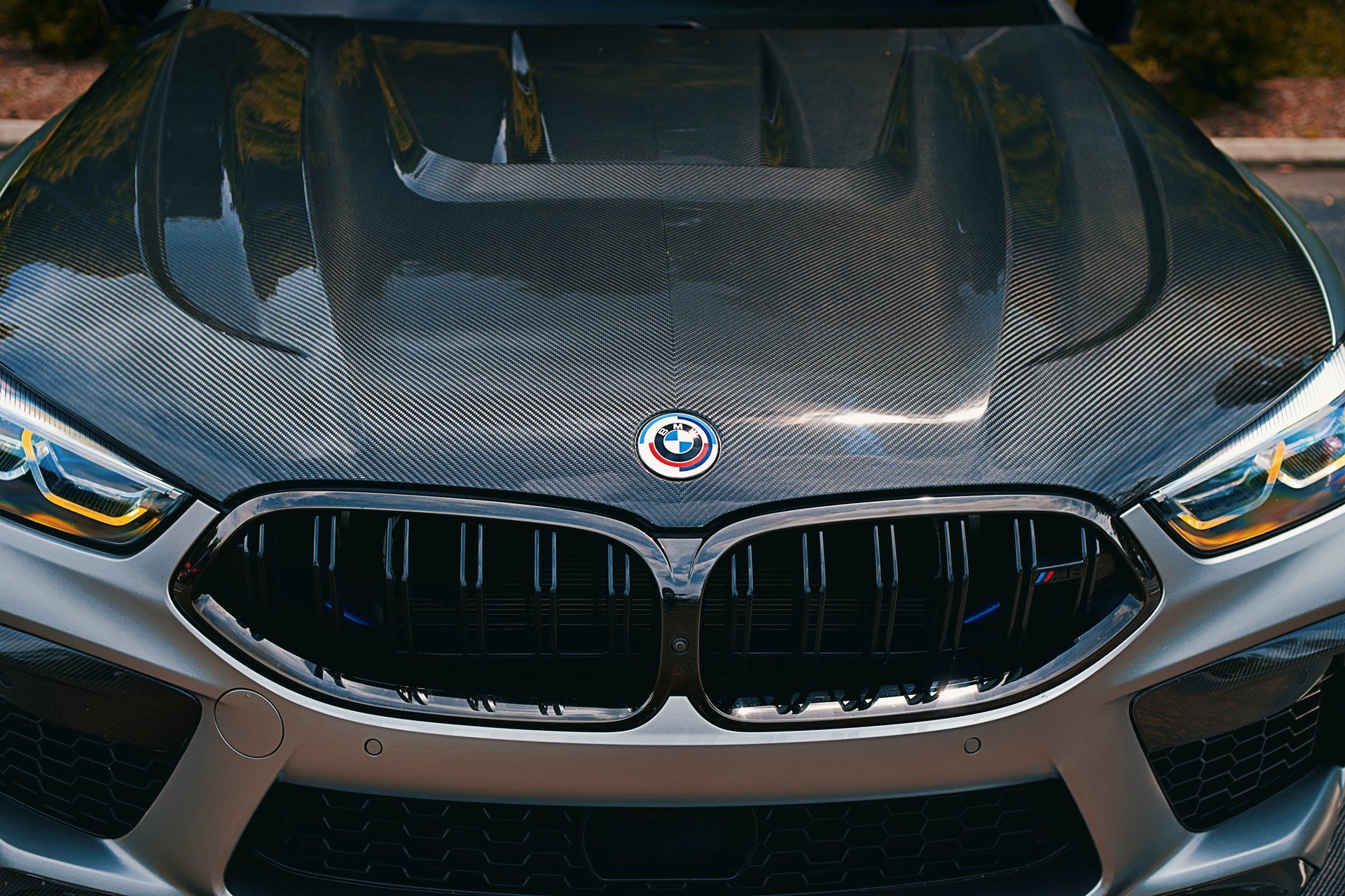 Electric blue BMW M3 Competition XDrive car photography at 704 Exotics in Charlotte, North Carolina.